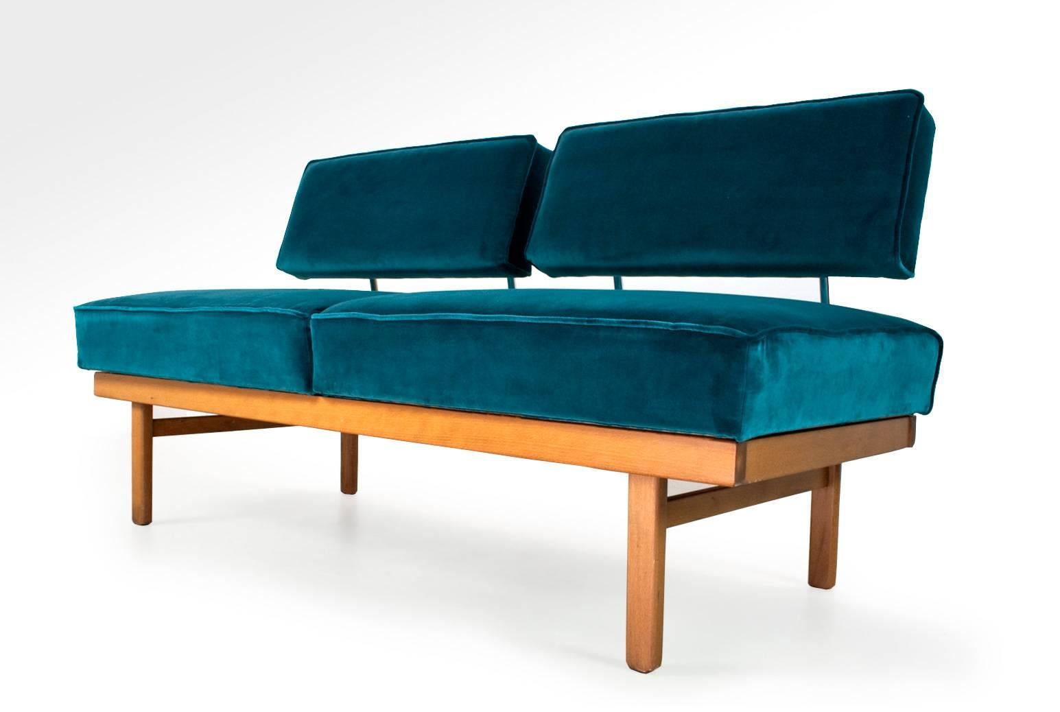 Mid-Century Modern daybed (or two-seat sofa) by Wilhelm Knoll, Germany 1950s, model 'Stella'. Re-upholstered in a high quality teal colored 100% cotton furniture velvet. A barrel-arbor mechanism changes the sofa into a comfortable daybed by sliding