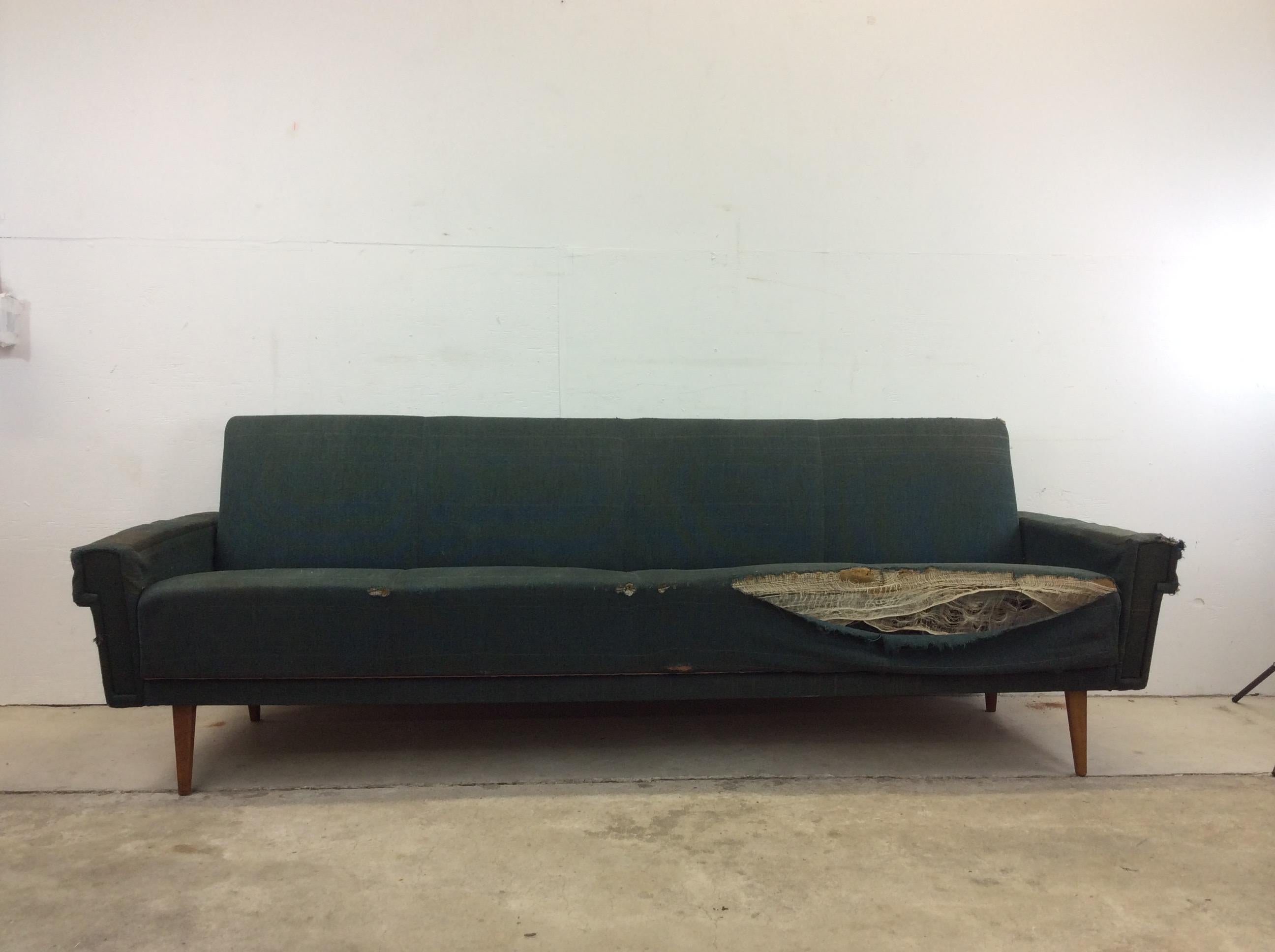 This Mid-Century Modern convertible sofa features hardwood construction, original upholstery which needs to be replaced, metal folding mechanism that converts it into a bed.??Dimension when opened: 88.5w 38.5d 17.5h

Dimensions: 88.5w 27.25d