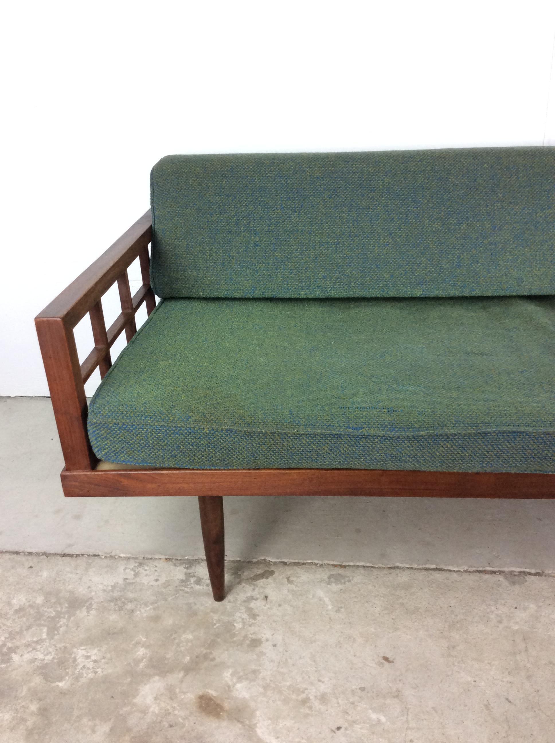 This mid century modern daybed sofa features hardwood construction, beautiful walnut finish, removable cushions with original upholstery, unique lattice-style armrests, and tall tapered legs.

Complimentary slat bench end table & coffee table