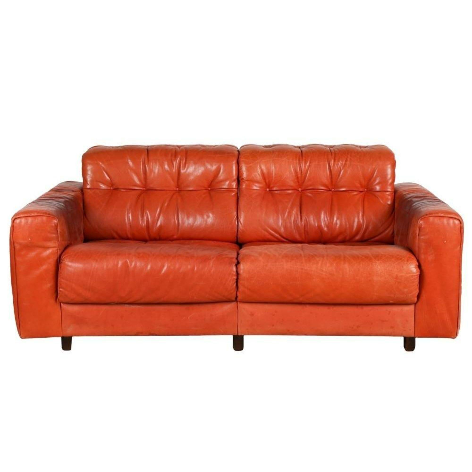 midcentury Modern De Sede Orange Leather Loveseat Sofa. It is as much a piece of modern art as it is seating. 

Additional information: 
Materials: Leather, Wood
Color: Orange
Brand: De Sede
Designer: De Sede
Period: Mid 20th Century