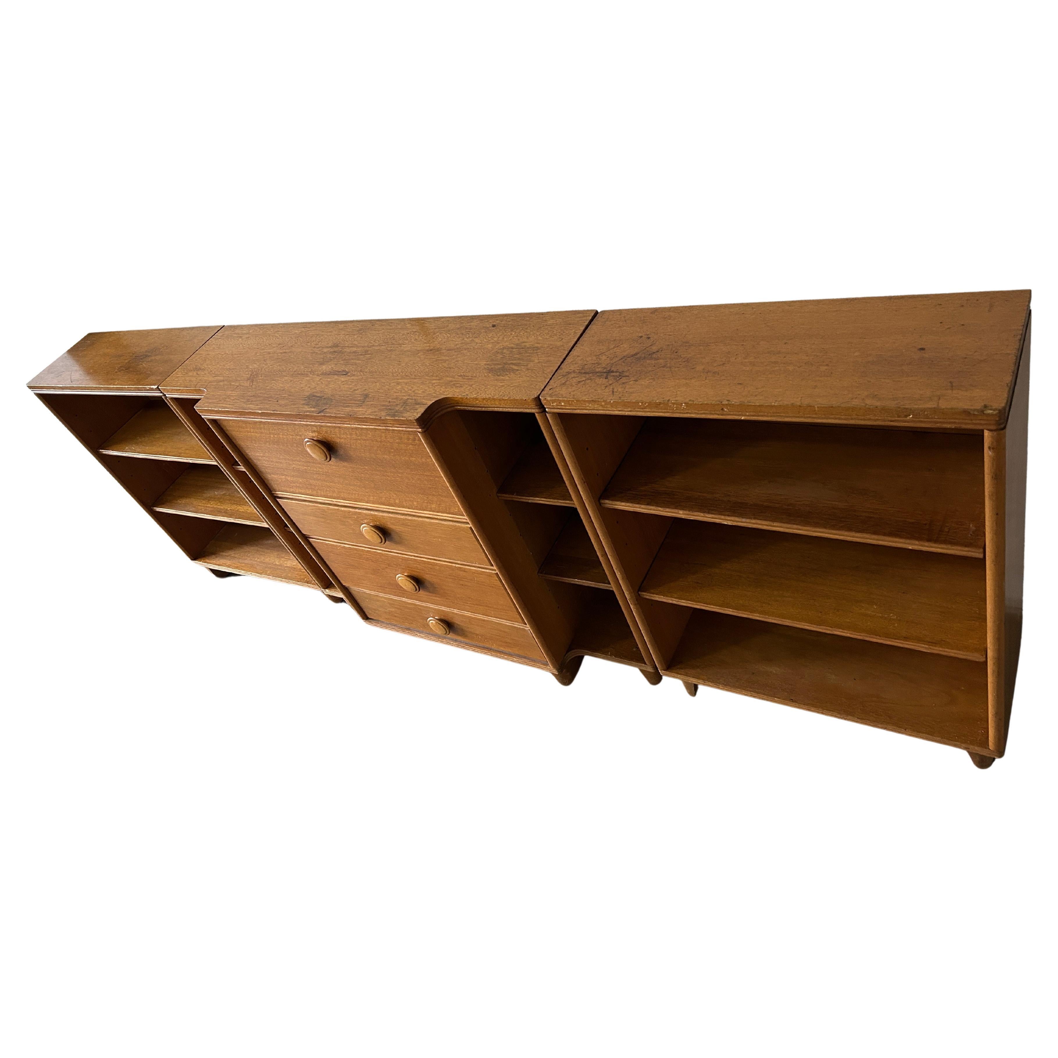 Deco Mid-Century Modern flip down desk with 3 lower drawers and 2 matching bookcases. The shelves are all adjustable or removable. The center top flips down into a desk and has a removable organizer. The center unit has narrow shelves on the left
