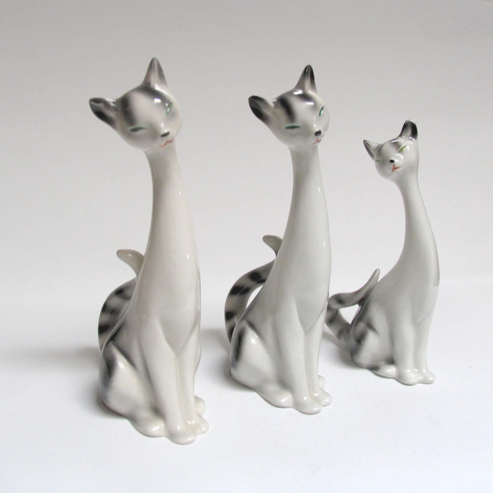 Mid-Century Modern decorative ceramic cats, Sweden, 1970s.
Three ceramic cats, long necks, very cute and decorative, a perfect gift for the cat lovers. In very good used condition, no damages, some minimal wear. All marked under the bottom.
 