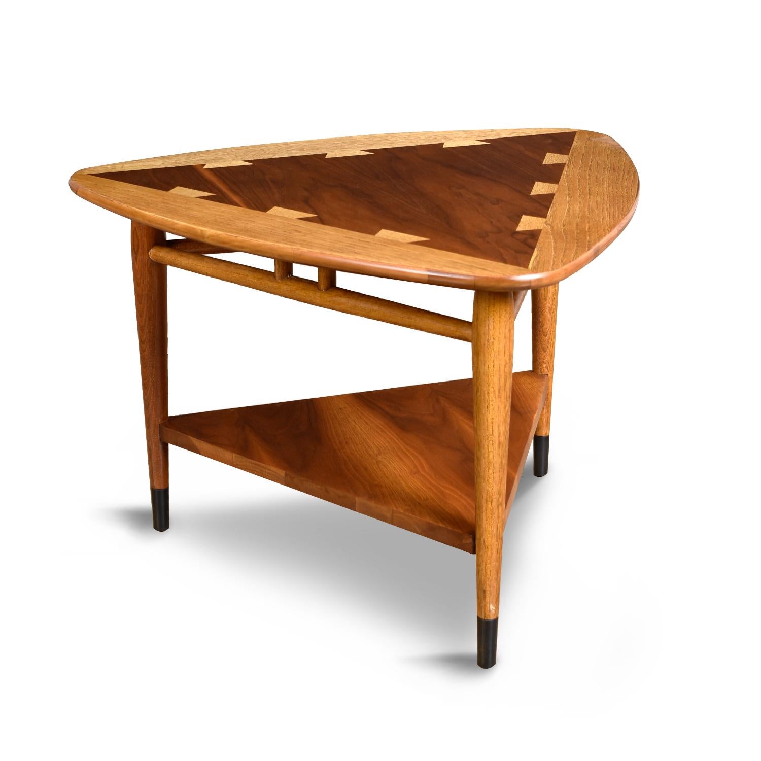 The Lane Acclaim guitar pick side table could be the most hard to find and sought after piece within the collection. Acclaim has become an American Mid-Century Modern Classic. The two-tone oak on walnut with exaggerated dove-tail design has become