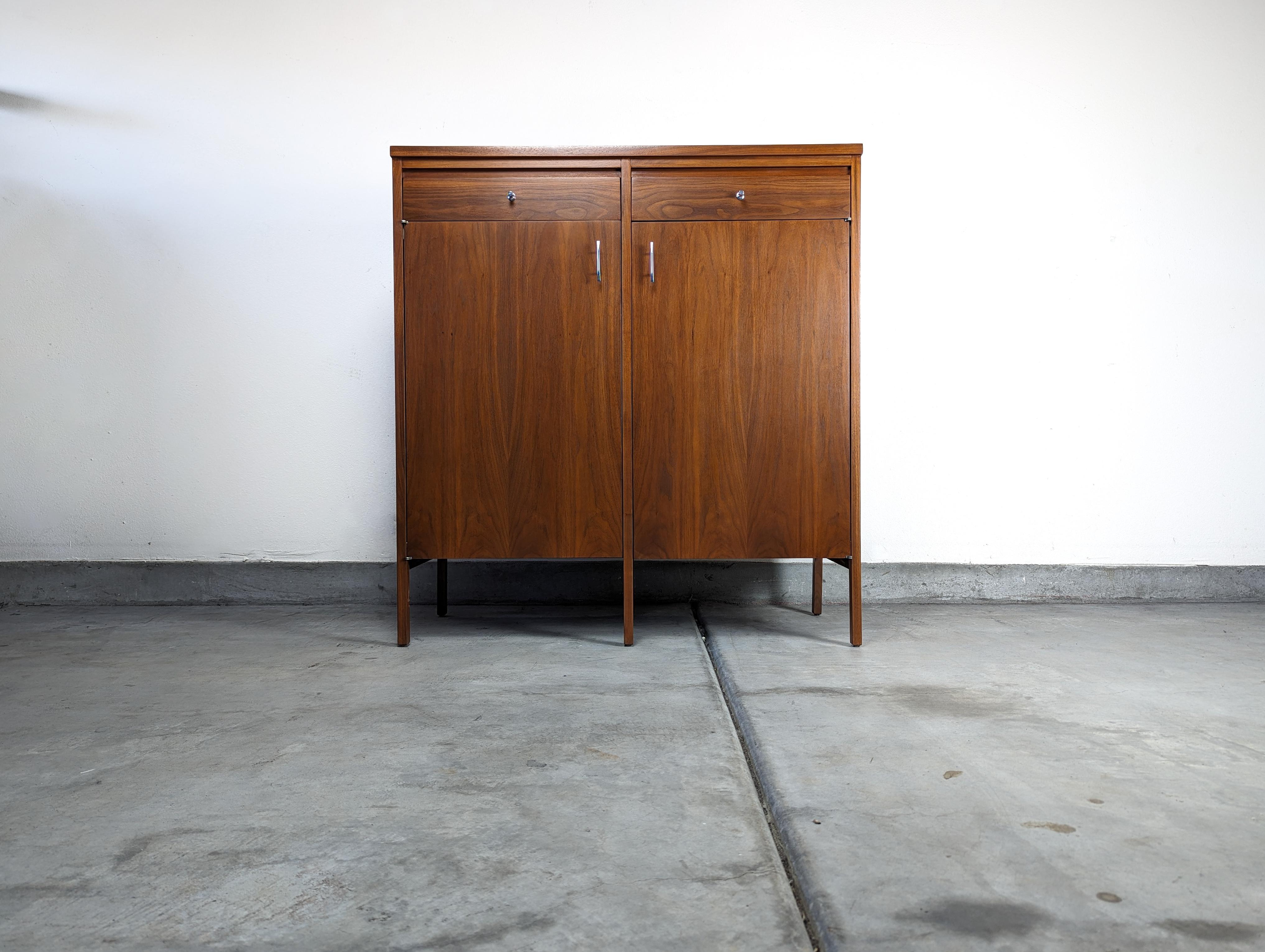 Prepare yourself to indulge in the timeless elegance and sophistication of mid-century modern design with this rare model of the 'Delineator' series Chest of Drawers. Designed by the renowned Paul McCobb and skillfully crafted by Lane in the 1960s,