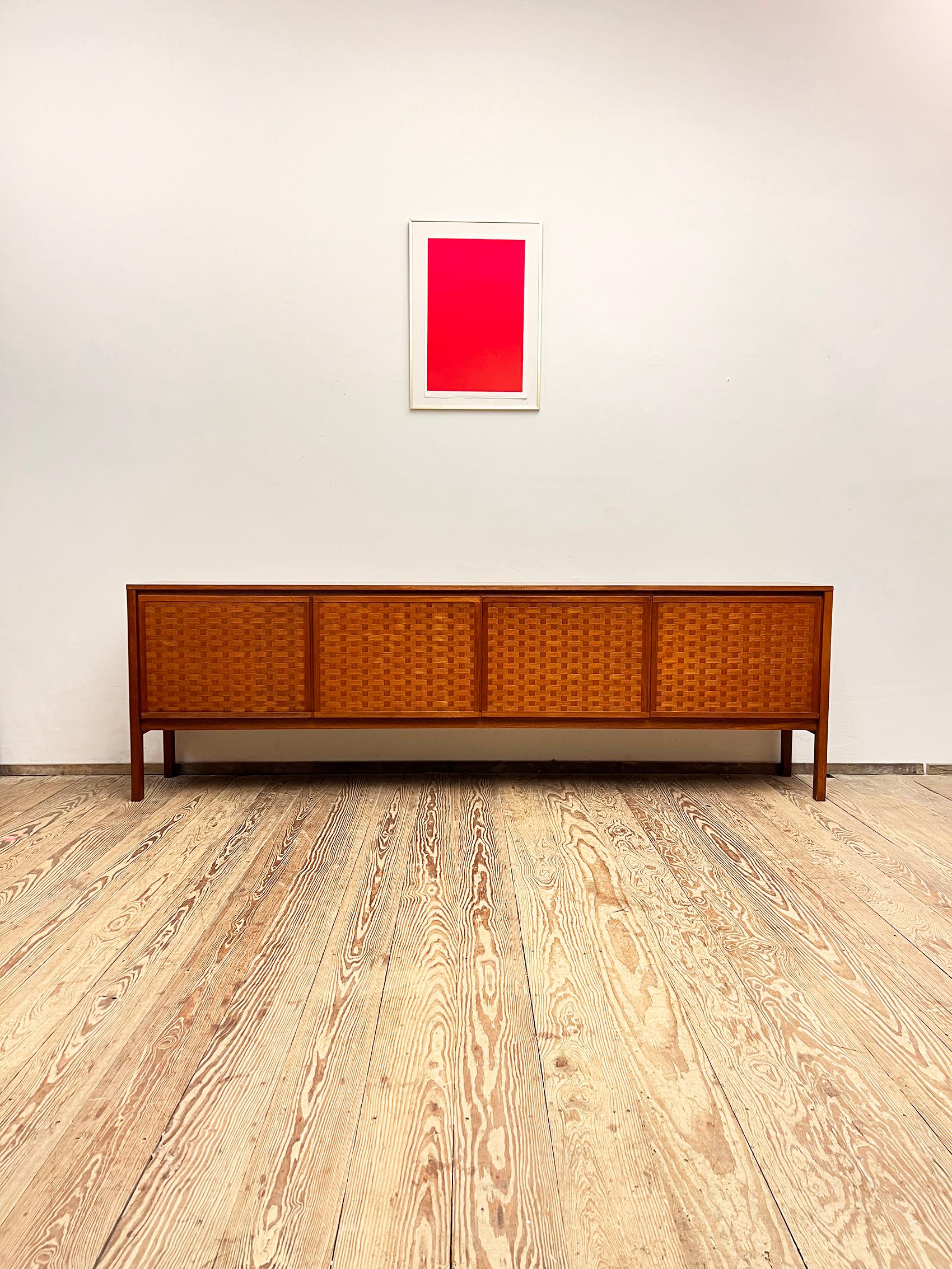 Dimensions (length x depth x height) 250 x 41 x 78,5 cm 

This very elegant large sideboard was designed in the 1960s by Leo Bub for Bub Wertmöbel, Germany. The mid-century modern credenza comes in a lovely teak wood finish 

and reduced,