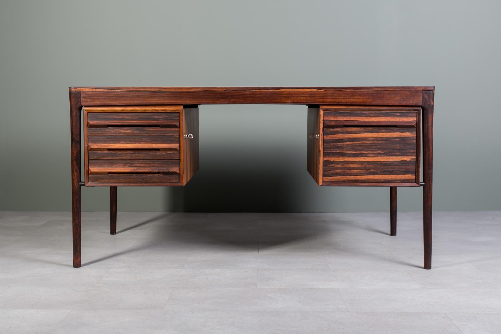 Discover the timeless elegance of this gorgeous Mid-Century desk, handcrafted in Norway during the 1960s by the renowned Bruksbo manufactory. Featuring the original label underneath the desk top, this piece is most probably designed by the esteemed