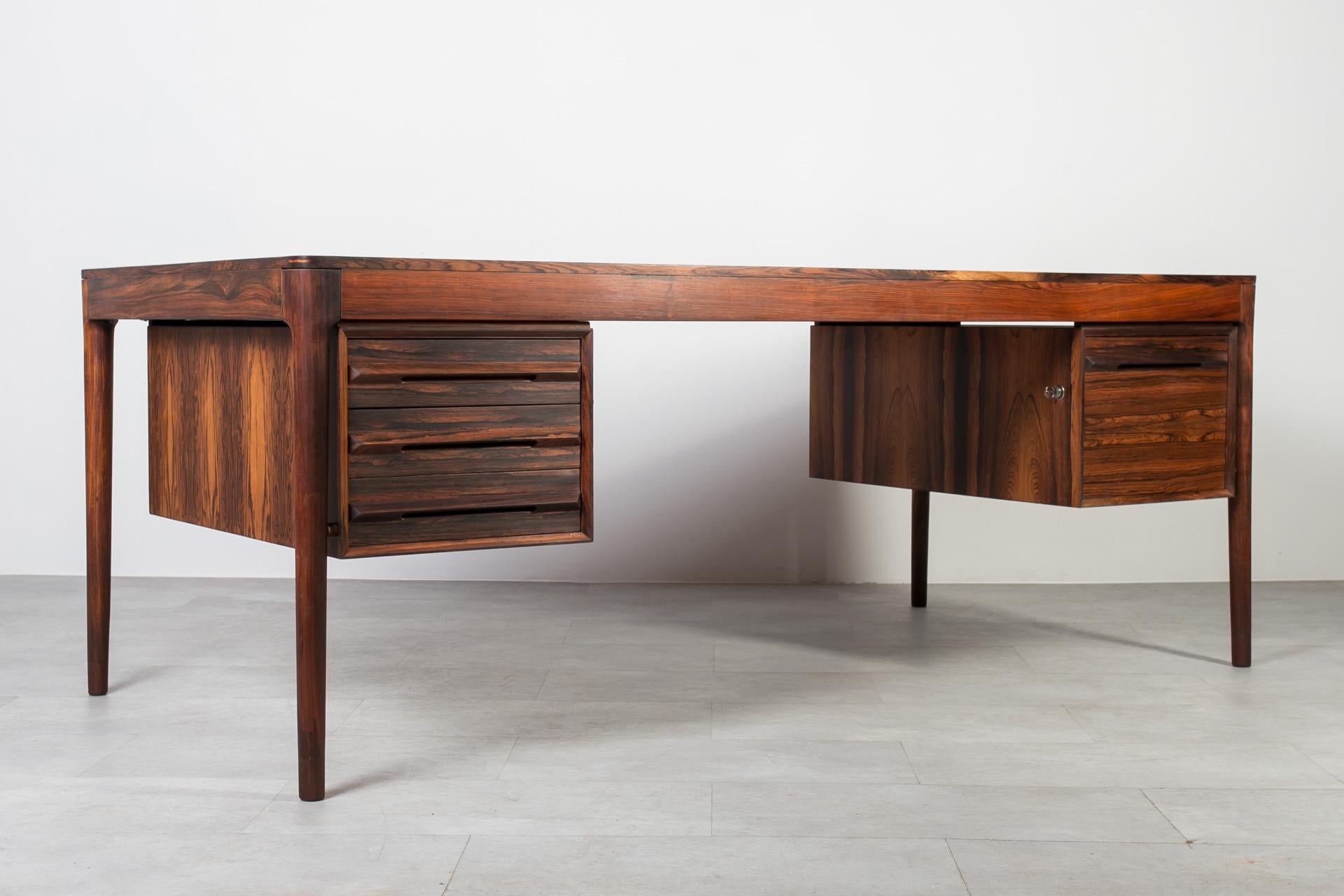 Discover the timeless elegance of this gorgeous Mid-Century desk, handcrafted in Norway during the 1960s by the renowned Bruksbo manufactory. Featuring the original label on the side of the drawer, this piece is most probably designed by the