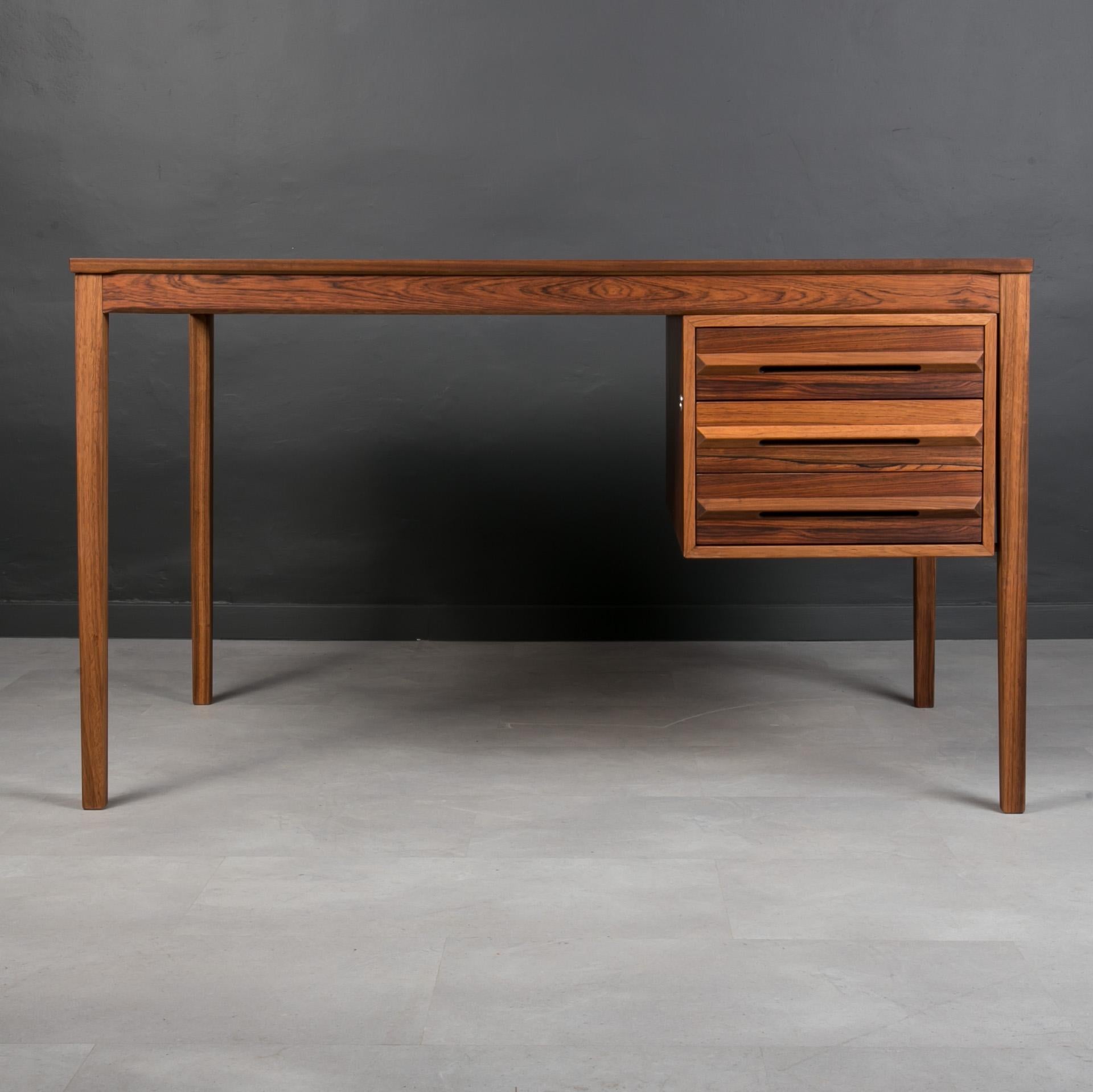 This stunning midcentury desk is a fantastic example of Torbjorn Afdal style, one of the most-appreciated Norwegian designers of 20th century. It was most probably produced by Bruksbo manufactory around 1960s. Pure in form yet very impressive. The