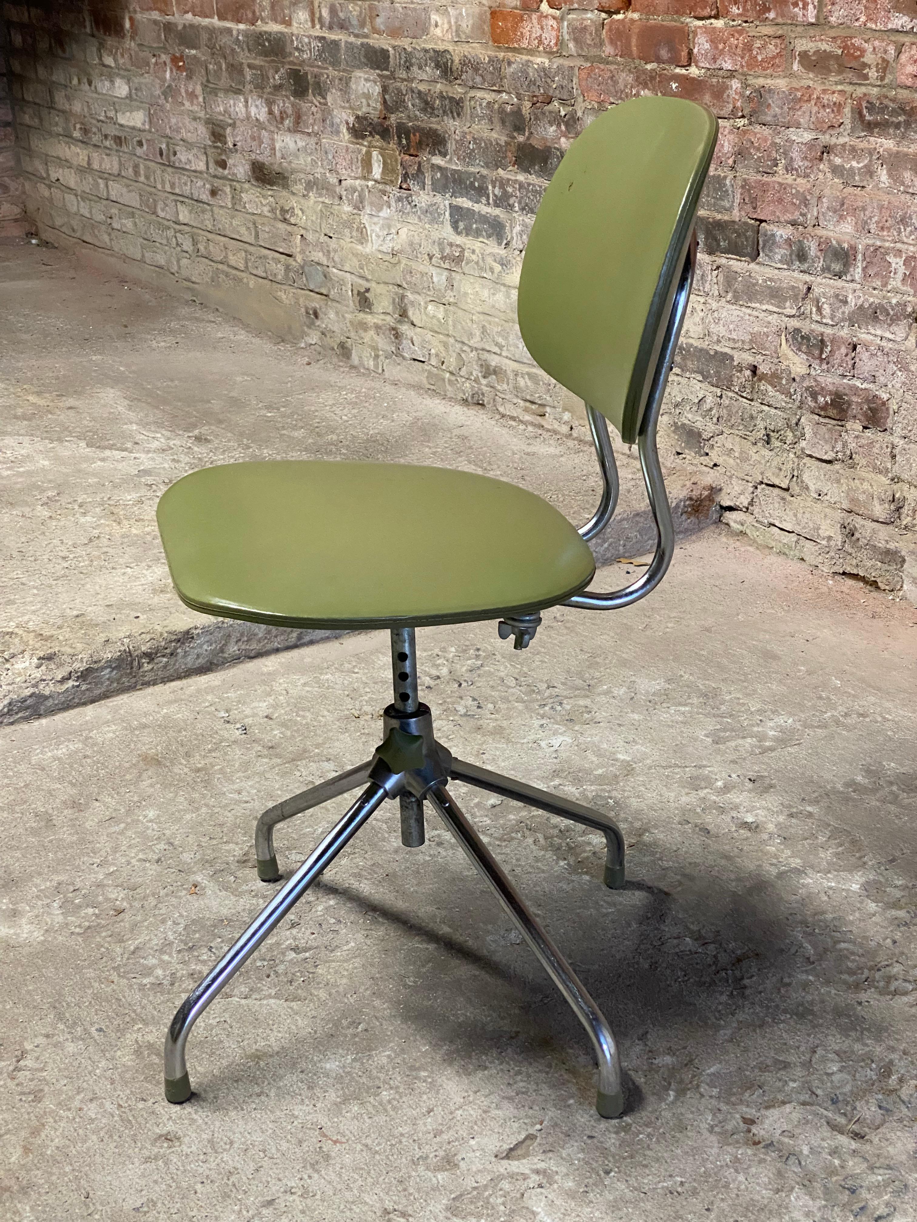 Swivel office chair with avocado vinyl seat and back. Circa 1960-70. Adjustable height and back tension.

Structurally sound and sturdy construction. Wear commensurate with age and use. Some minor fading of the vinyl seat and back. Minor abrasions