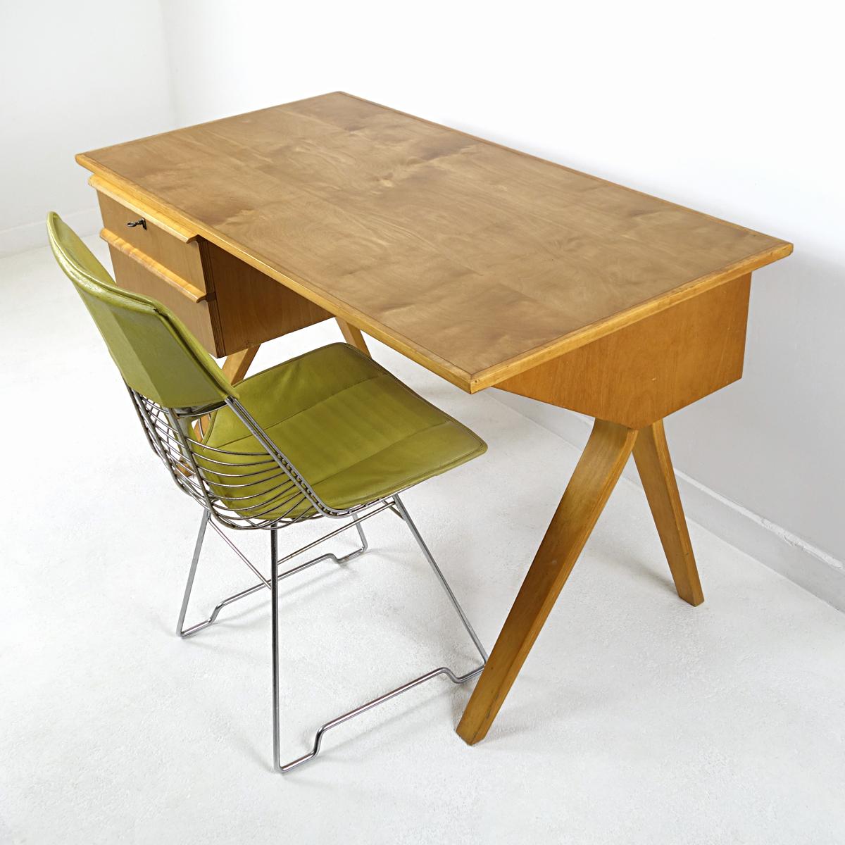 Elegant writing desk designed in 1952 by Cees Braakman for USM Pastoe.
The desk is made of plywood and has a birchwood finish. The top and drawers have recently been renovated. 
This piece looks great both against a wall as freestanding. It