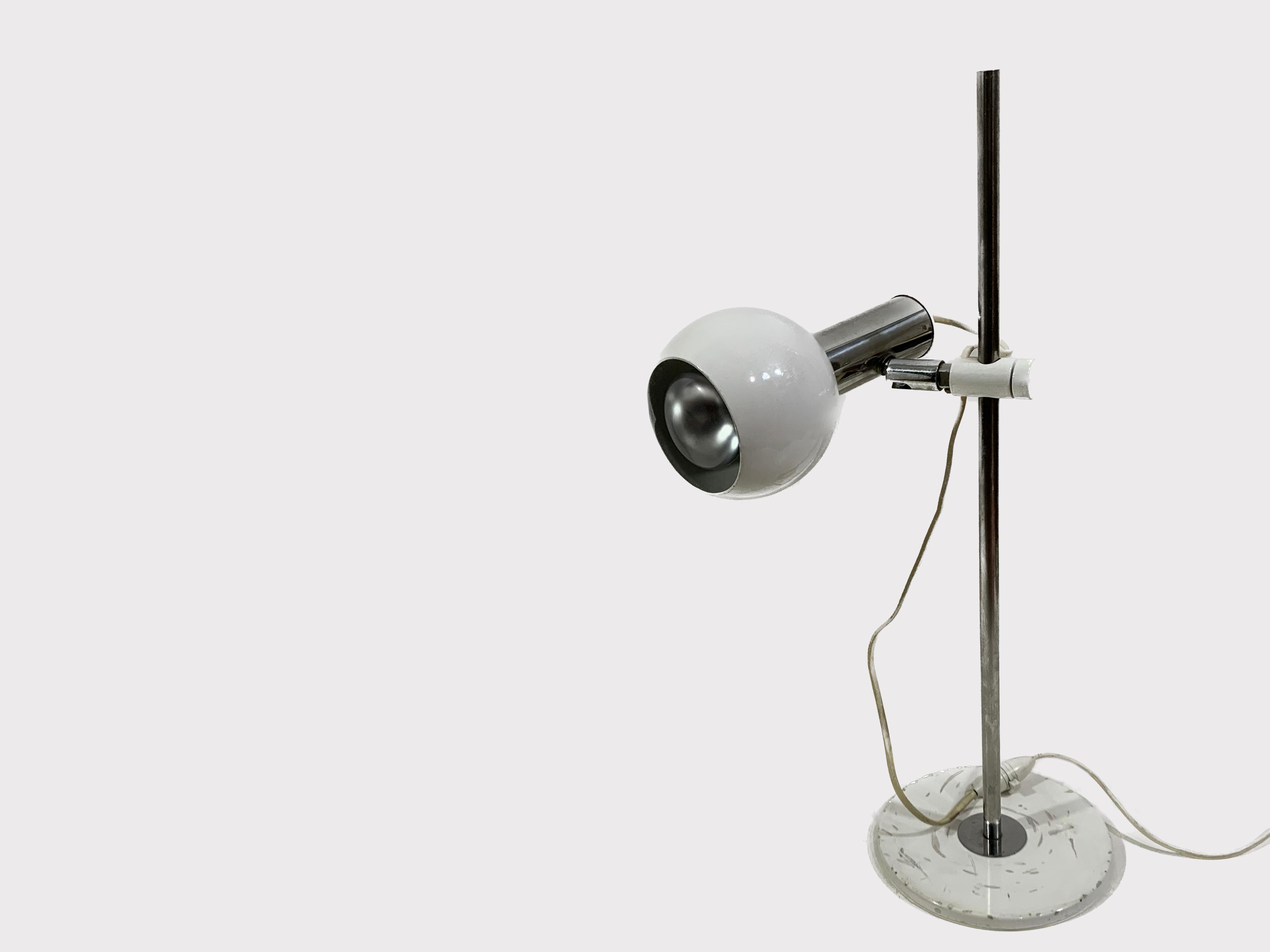 Minimalist design from the 1950's that was considered far ahead of its time. Made from metal, mounted on a high rod which allows the user to adjust the height of the light.
Head is also steerable and can be adjusted in several different directions