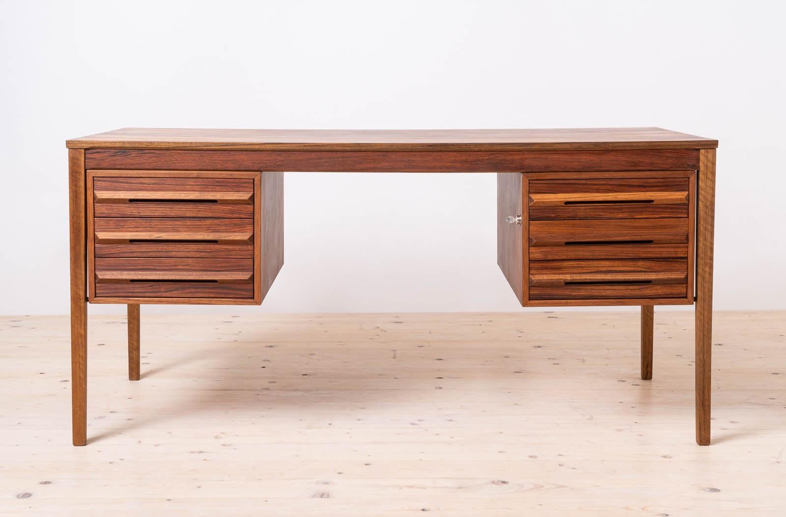 Discover the timeless elegance of this gorgeous Mid-Century desk, handcrafted in Norway during the 1960s, quite probably by the renowned Bruksbo manufactory. This piece is most probably designed by the esteemed Torbjörn Afdal, showcasing superb