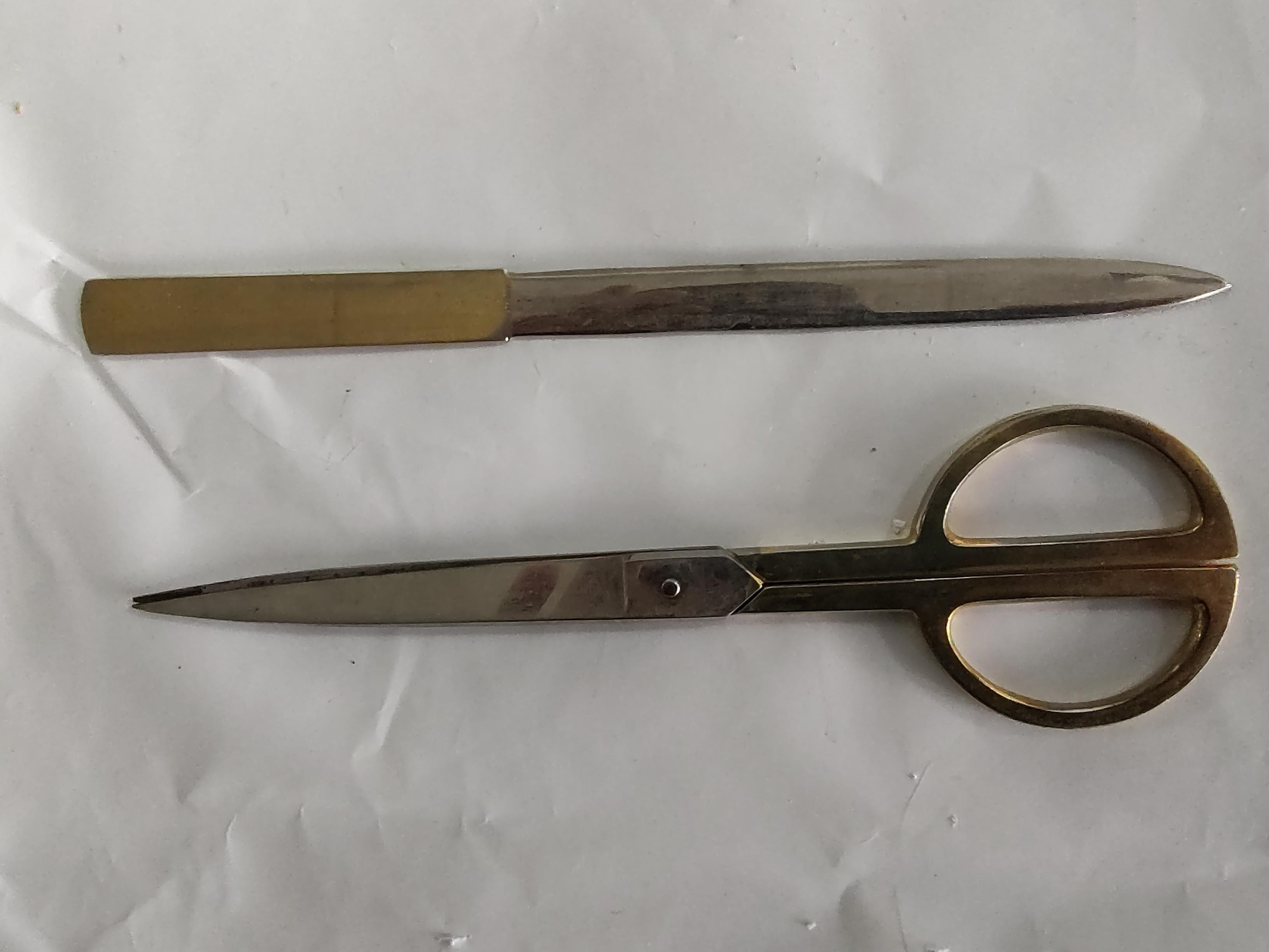 Fabulous set of a scissors and a letter opener in a leather bound case.
Made in Italy from the sixties. In excellent vintage condition with minimal wear.