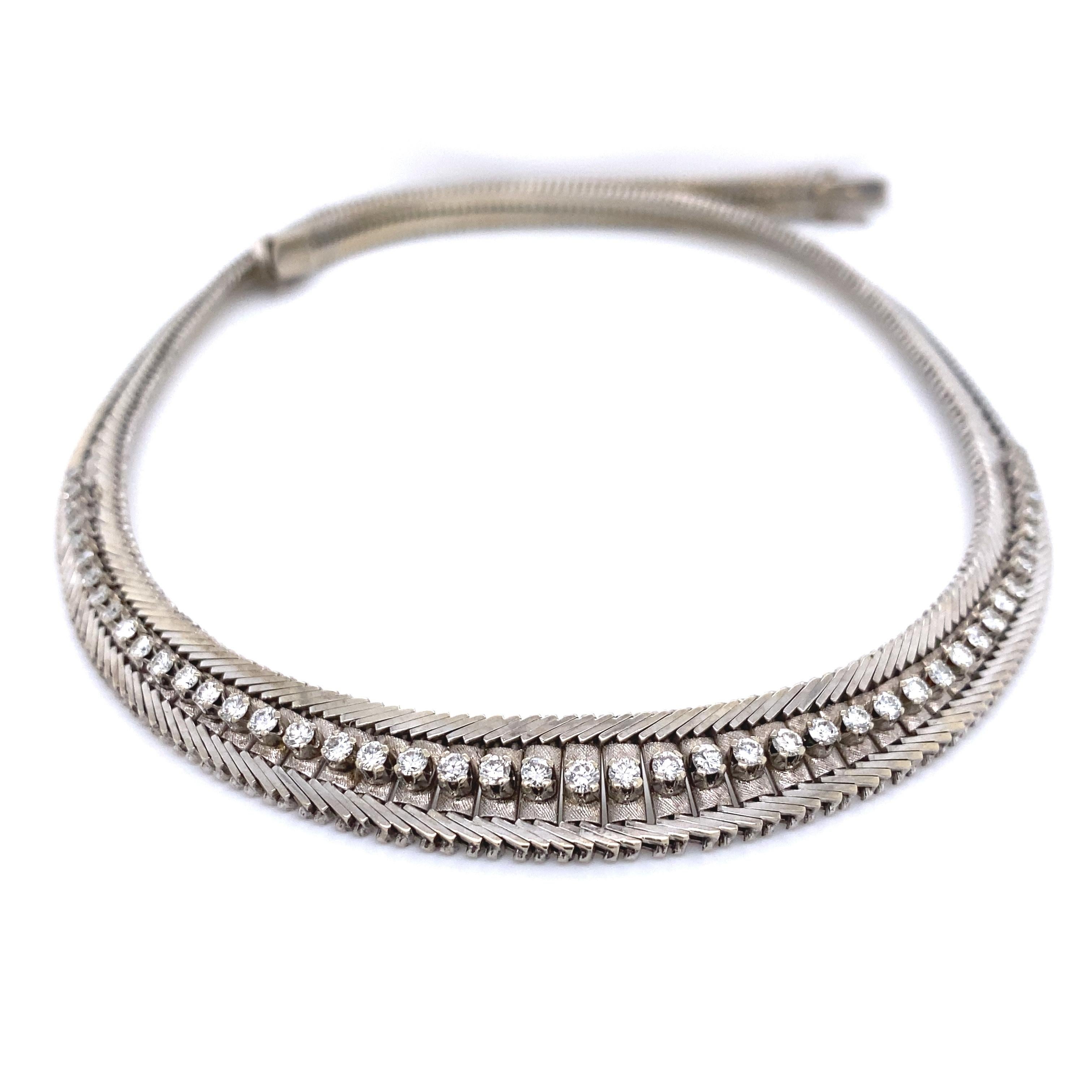 Chic and Stylish! Beautiful Diamond 18K Gold Mid Century Modern Collar Necklace. Hand set with 47 Diamonds, weighing approx. 2.00 total Carat weight. Necklace measures approx. 16.5” long. Hand crafted in 18K White Gold. Circa: 1950s. More Beautiful