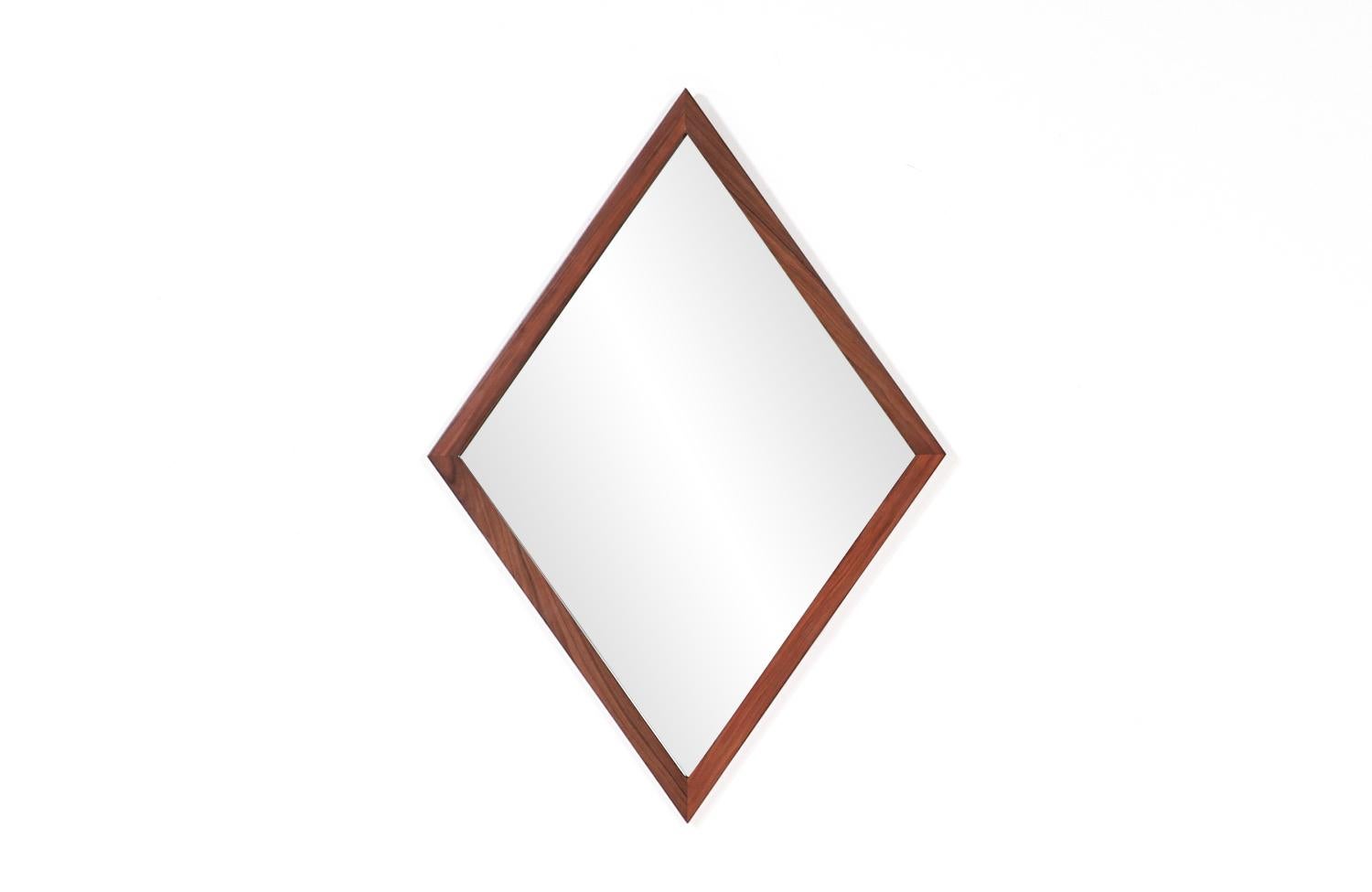 Mid-Century Modern diamond shape rosewood mirror.

________________________________________

Transforming a piece of Mid-Century Modern furniture is like bringing history back to life, and we take this journey with passion and precision. With over