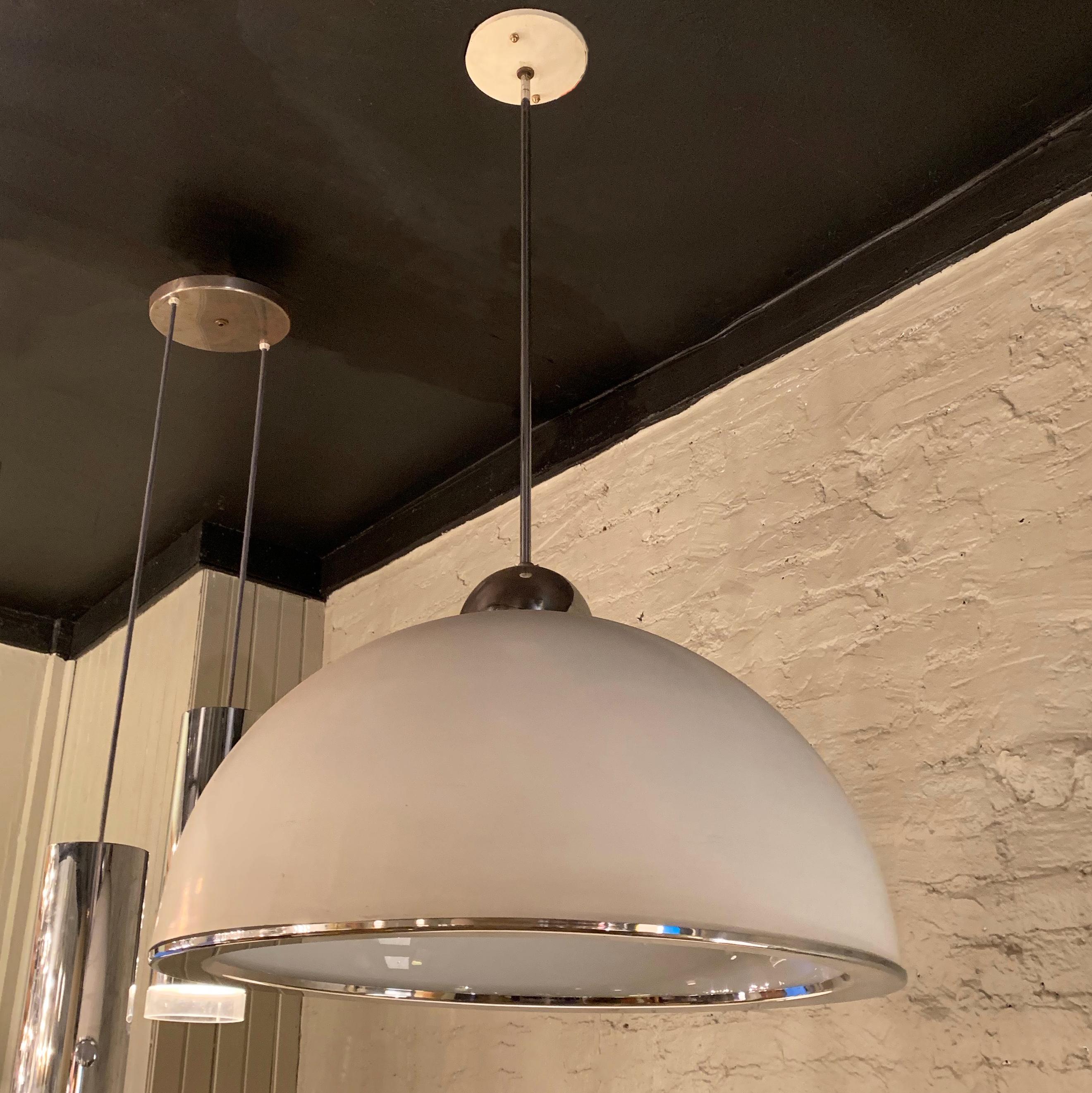 Mid-Century Modern, pendant light features a painted aluminum dome shade with chrome trim and stem with diffused milk glass interior. The pendant takes 2 bulbs up to 100 watts each. Overall height of the pendant is 36 inches.