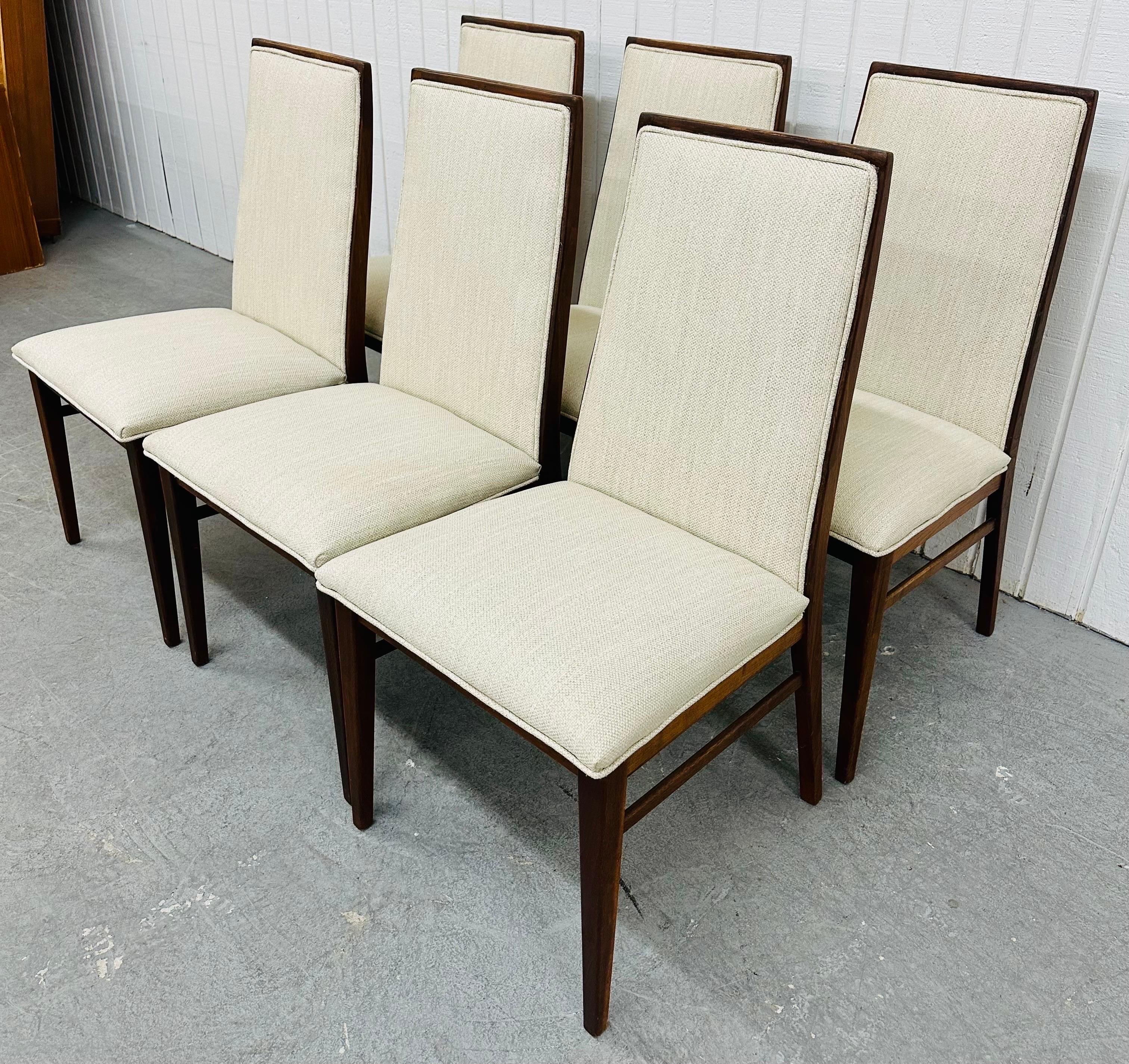 This listing is for a set of six Mid-Century Modern Dillingham Walnut Dining Chairs. Featuring a straight line design, six straight chairs, newly upholstered back rests and seats, and a beautiful walnut finish. This is an exceptional combination of