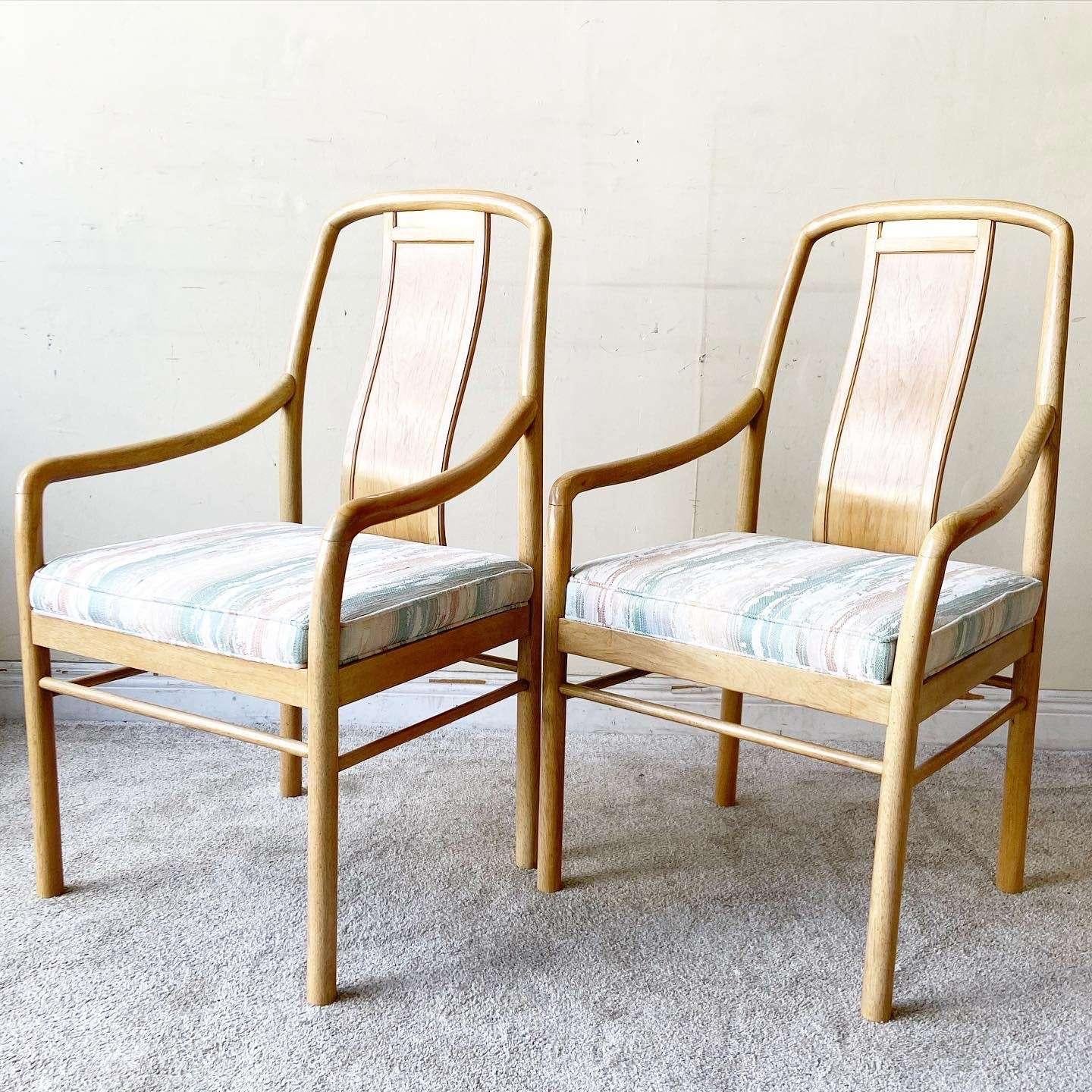 Amazing pair of mid century modern dining chairs by Drexel Heritage. Each ratio a wooden frame with a gold strip at the top of the back rest.

Seat height is 19.5 in