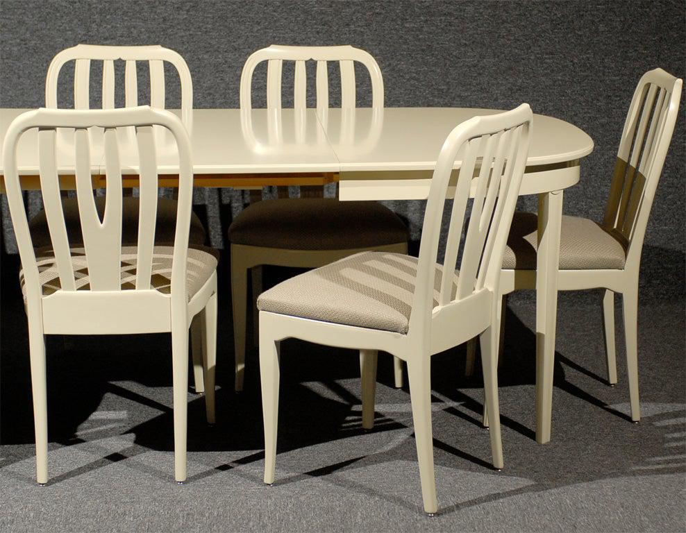 Beautifully restored Swedish Modern Gustavian Style vintage dining chair set by renowned Swedish furniture designer Carl Malmsten.

Eight sturdy chairs newly reupholstered in Belgian gray/taupe woven linen. Dimensions: 19 1/2 W x 19 1/2 D x 35 3/4