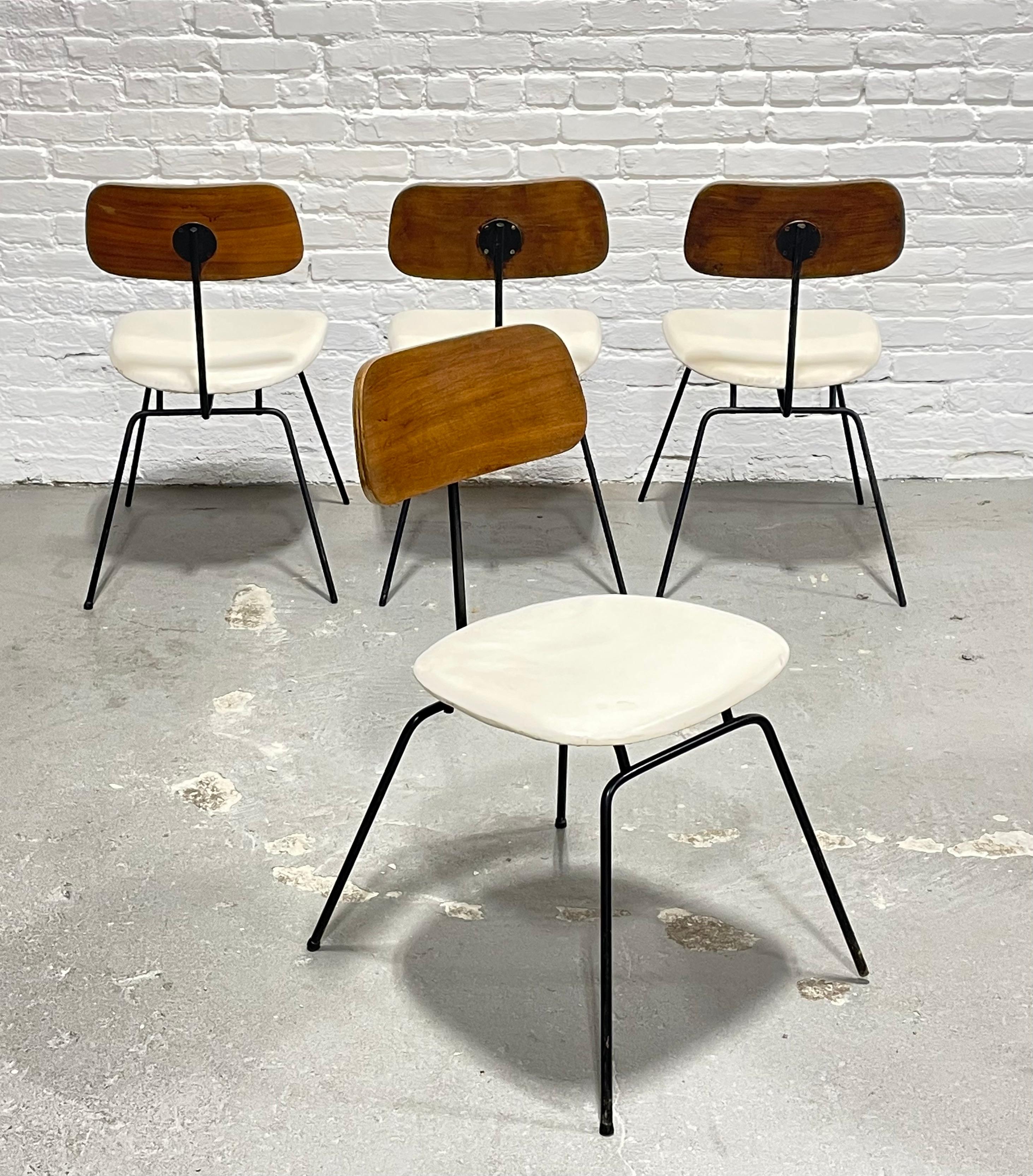 Mid Century Modern Dining Chairs in the style of Clifford Pascoe, c. 1960's. This unique set is made with walnut wood and solid + sturdy black iron bases. This set is the perfect combination of mid century with a hint of industrial design. Good
