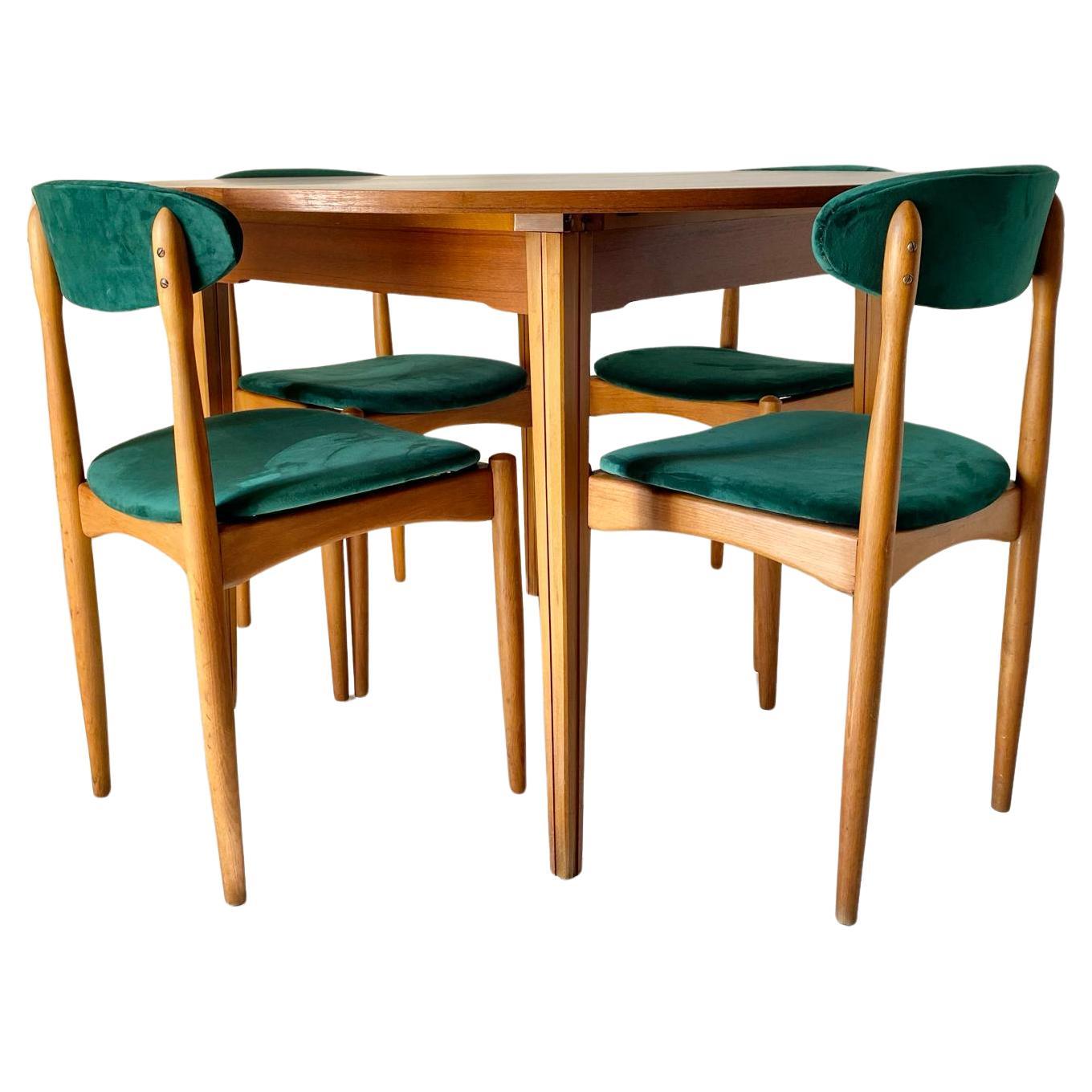 Scandinavian Mid Century Modern Dining Set designed in the Style of Halas. Manufactured in Italy in the 1960 's. The set is made of four beautiful dining chairs in solid beech wood with green fabric seats and a round beech table with solid wood