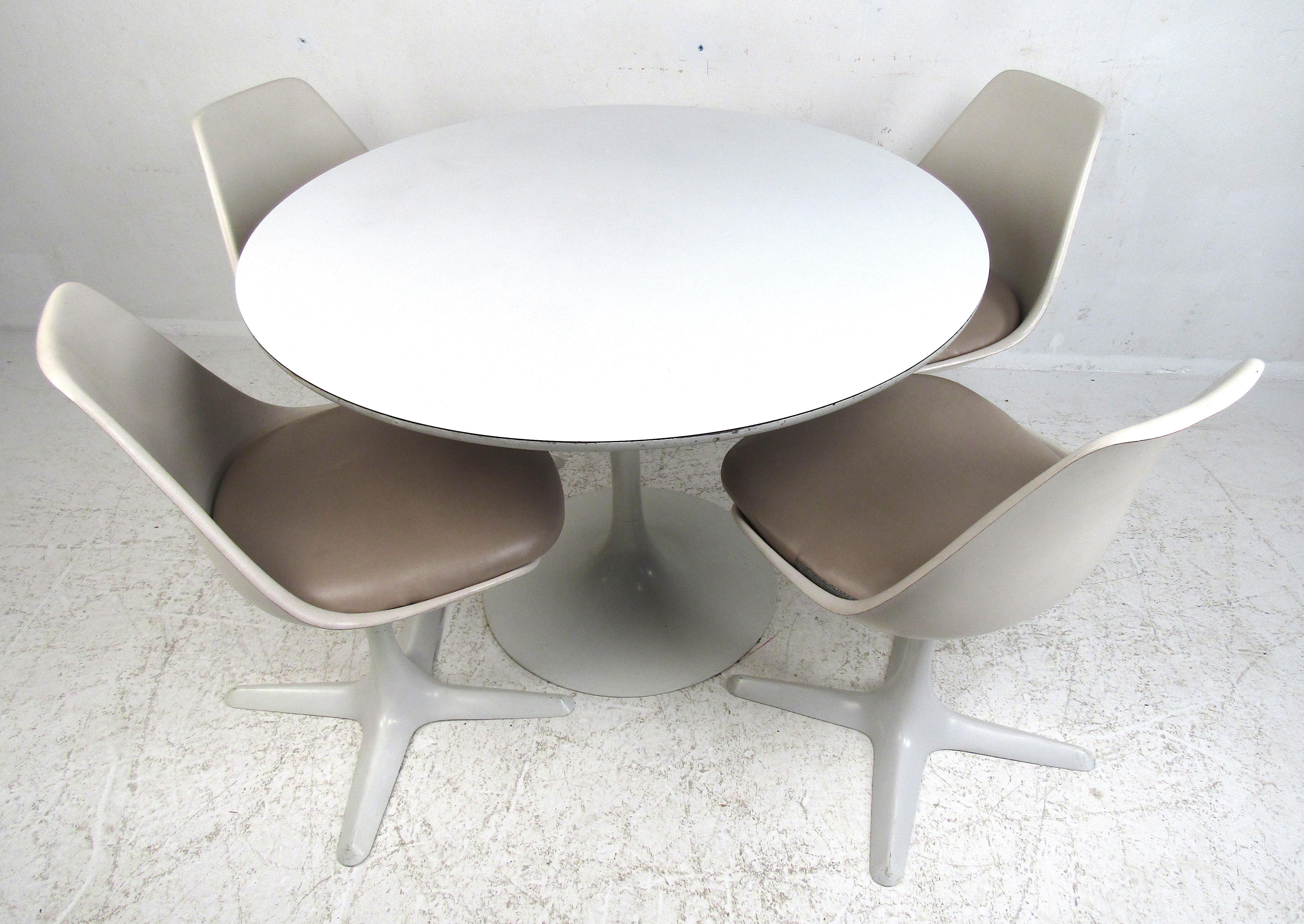 Modeled after Saarinen's Tulip series of tables and chairs, the Arkana chair was designed by Maurice Burke in 1965 for the Arkana company in England. It features the classic hourglass shape and fiberglass seat with a 4 legged base.
The accompanying