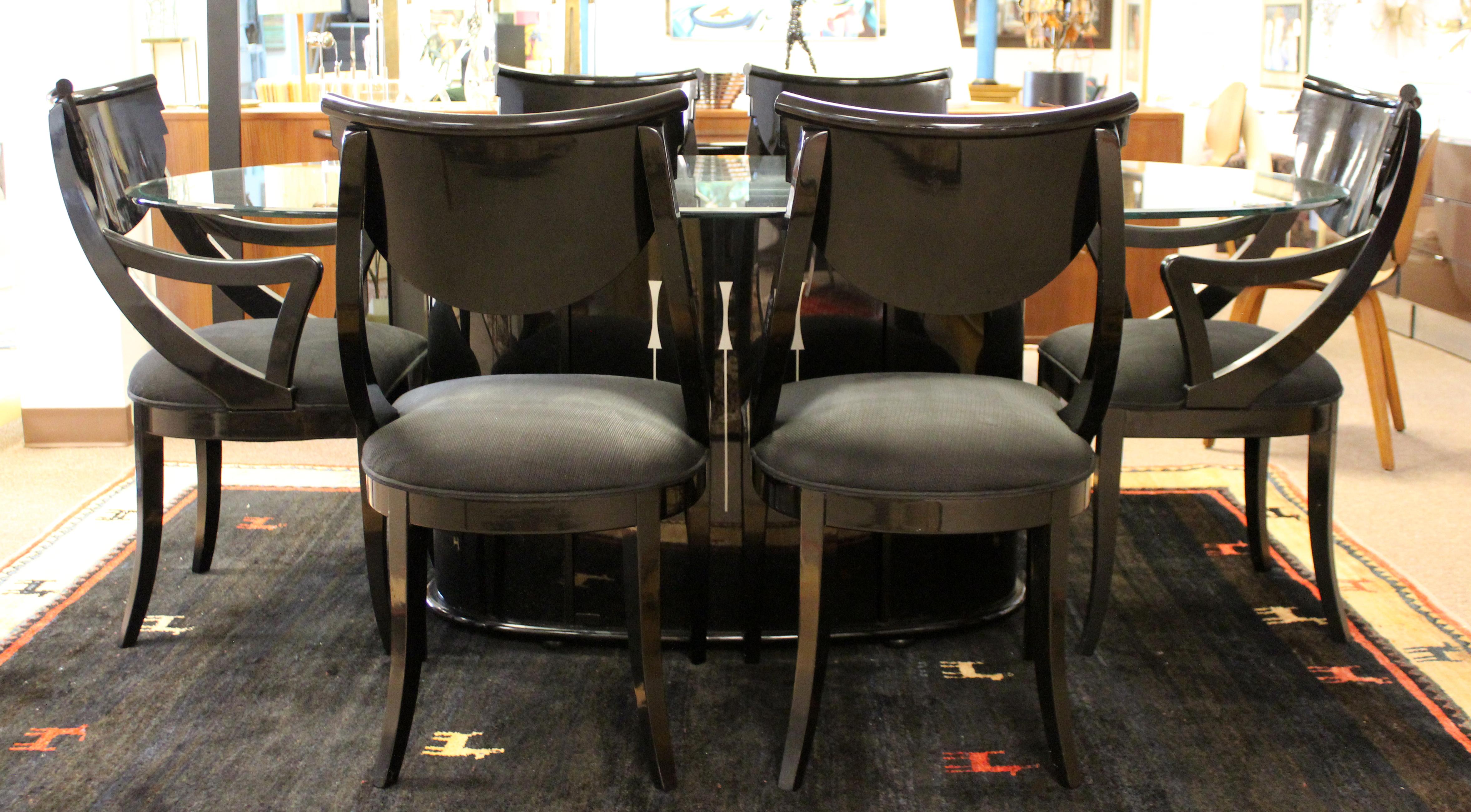 For your consideration is a lux looking, black lacquer dining set, including table with storage compartment, two armchairs and four side chairs, by Pietro Constantini for Ello, made in Italy, circa 1970s. In excellent vintage condition. The