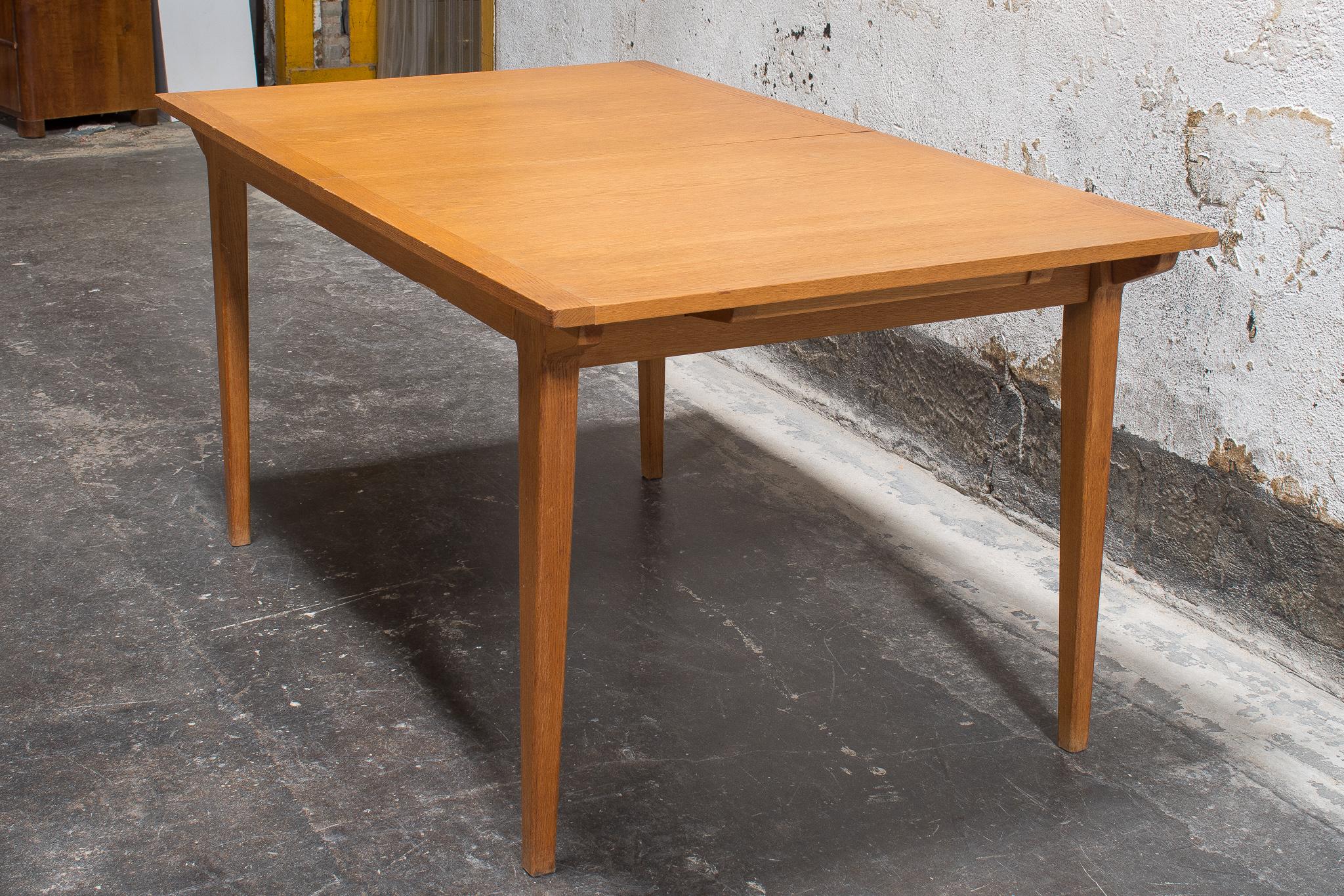 Swedish Mid-Century Modern dining table made of Golden Oak. A modern table with clean lines and a natural finish, it's the perfect relaxed backdrop for your next meal. The dining table is attributed to noted Swedish designer, Bengt Ruda. Ruda