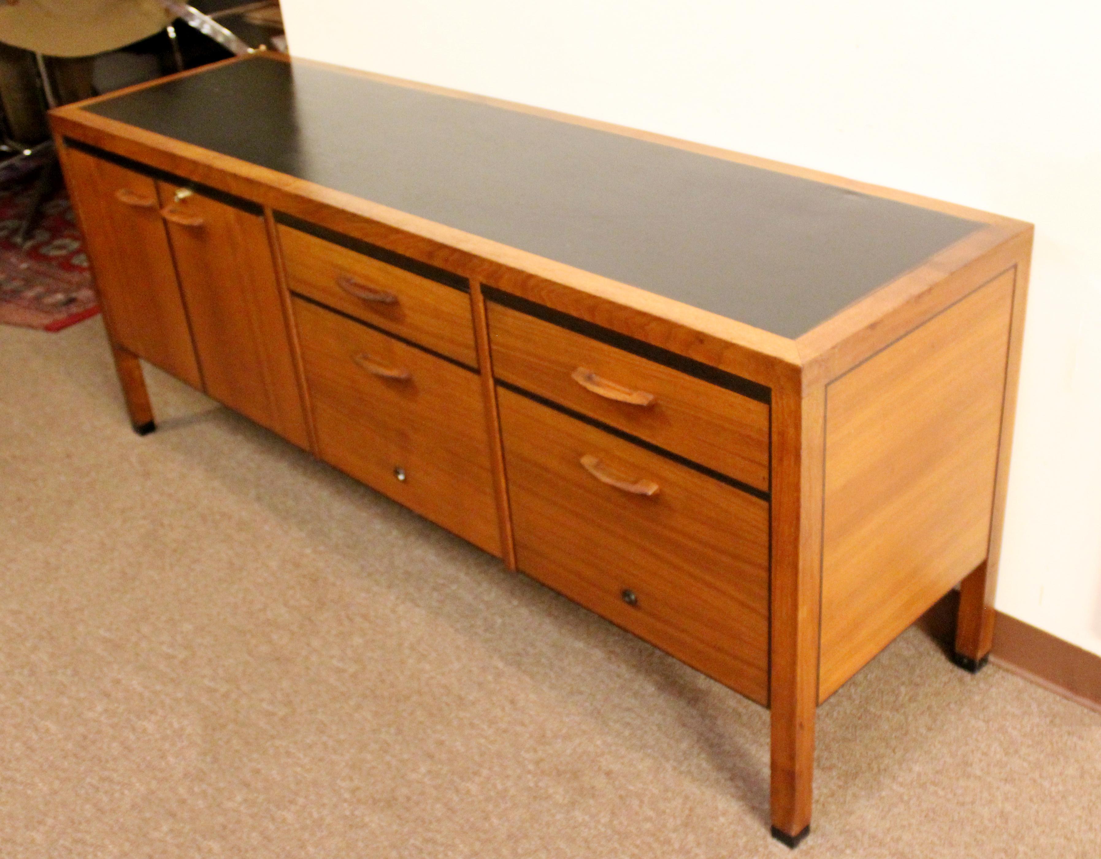 For your consideration is an excellent example of an executive credenza file cabinet, with four drawers, by Directional, circa the 1960s. In good vintage condition. The dimensions are 72