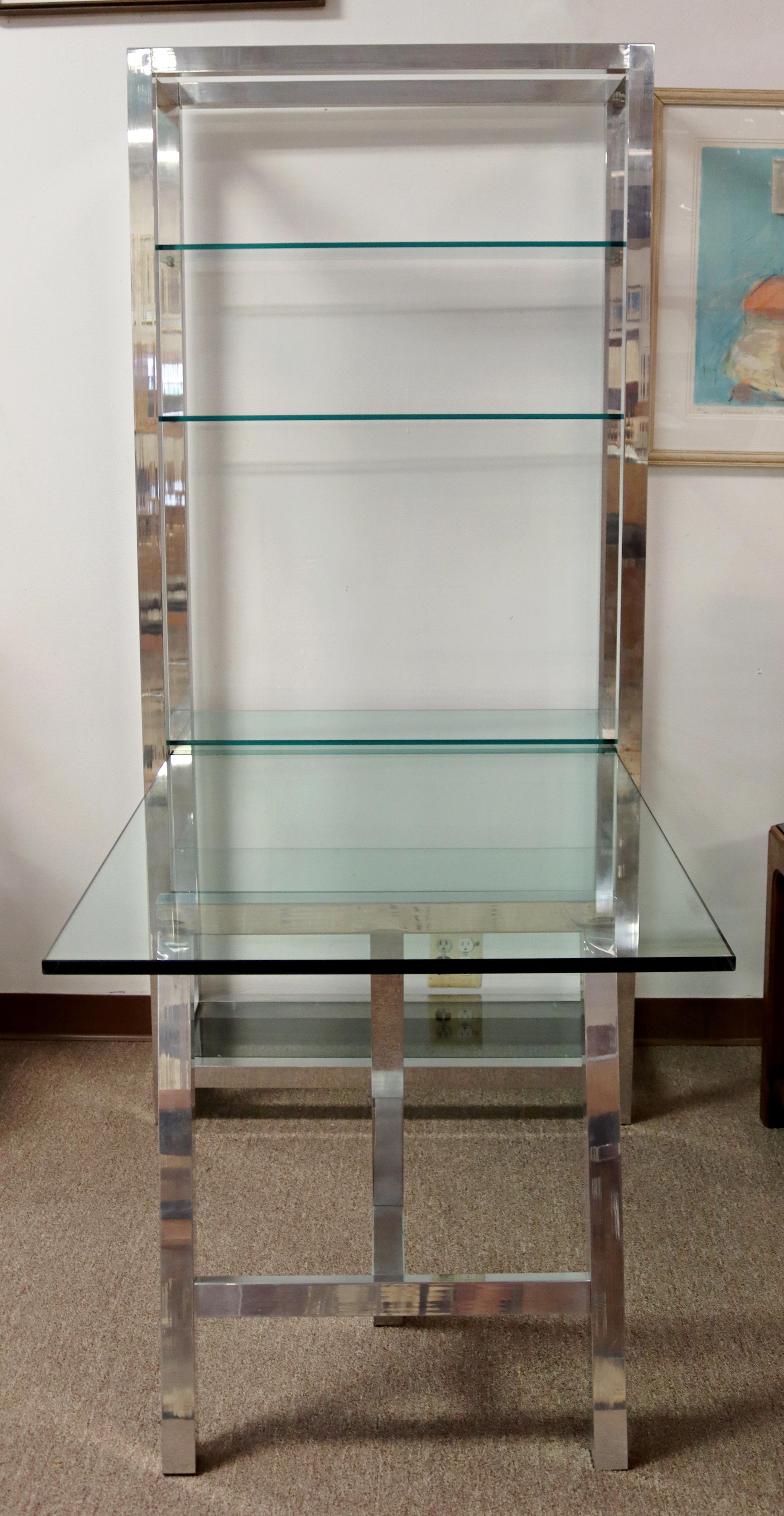 For your consideration is a great, aluminum shelving unit etagere, with five glass shelves and an attached desk, by Directional, circa the 1980s. In very good vintage condition. The dimensions are 35.5