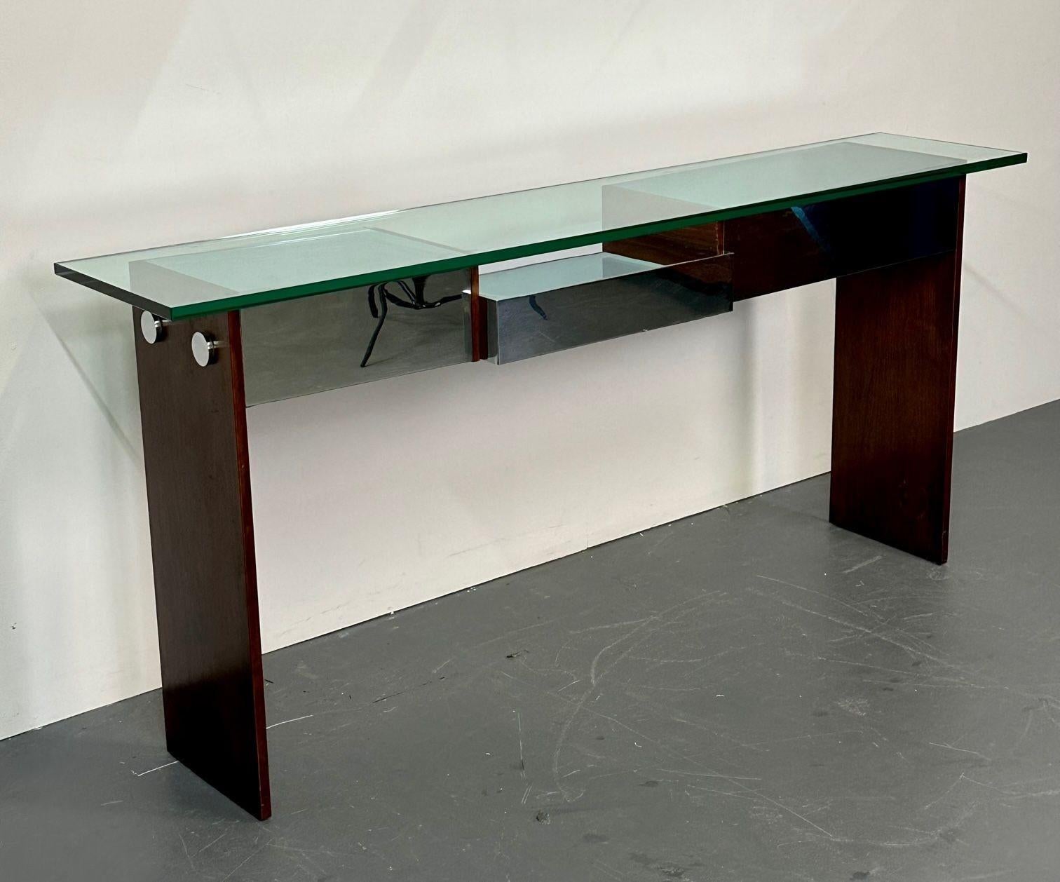 Mid-Century Modern Directional Chrome and Rosewood Console Table, Glass
Mahogany side panels highlighted by chrome facets and fastening accents make this console table from Directional a Modern stunner.  Additionally the substantive glass top