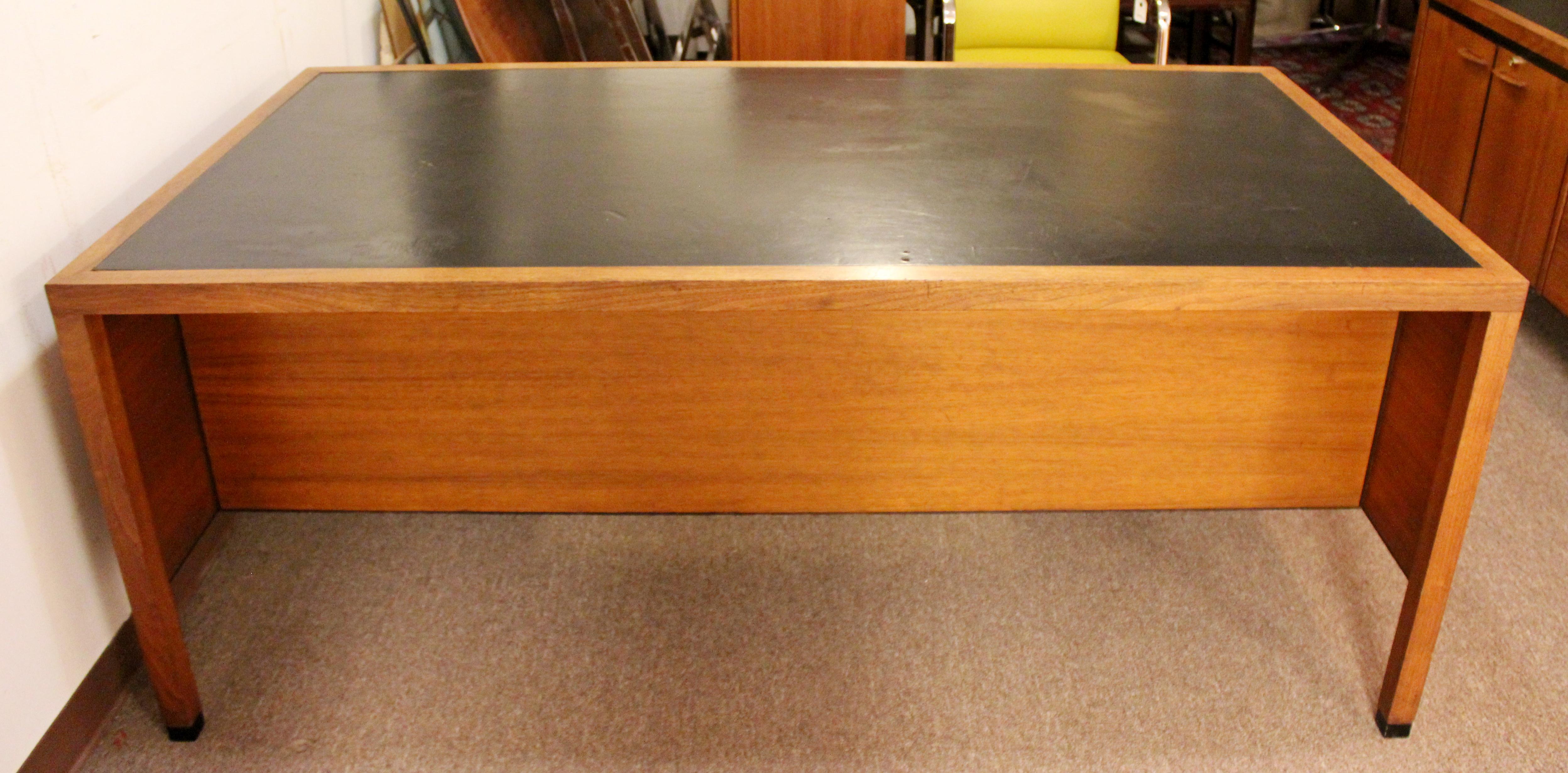 For your consideration is an incredible, leather topped, executive desk and matching credenza, both with filing drawers, by Directional, circa 1960s. In good vintage condition. The dimensions of the desk are 72