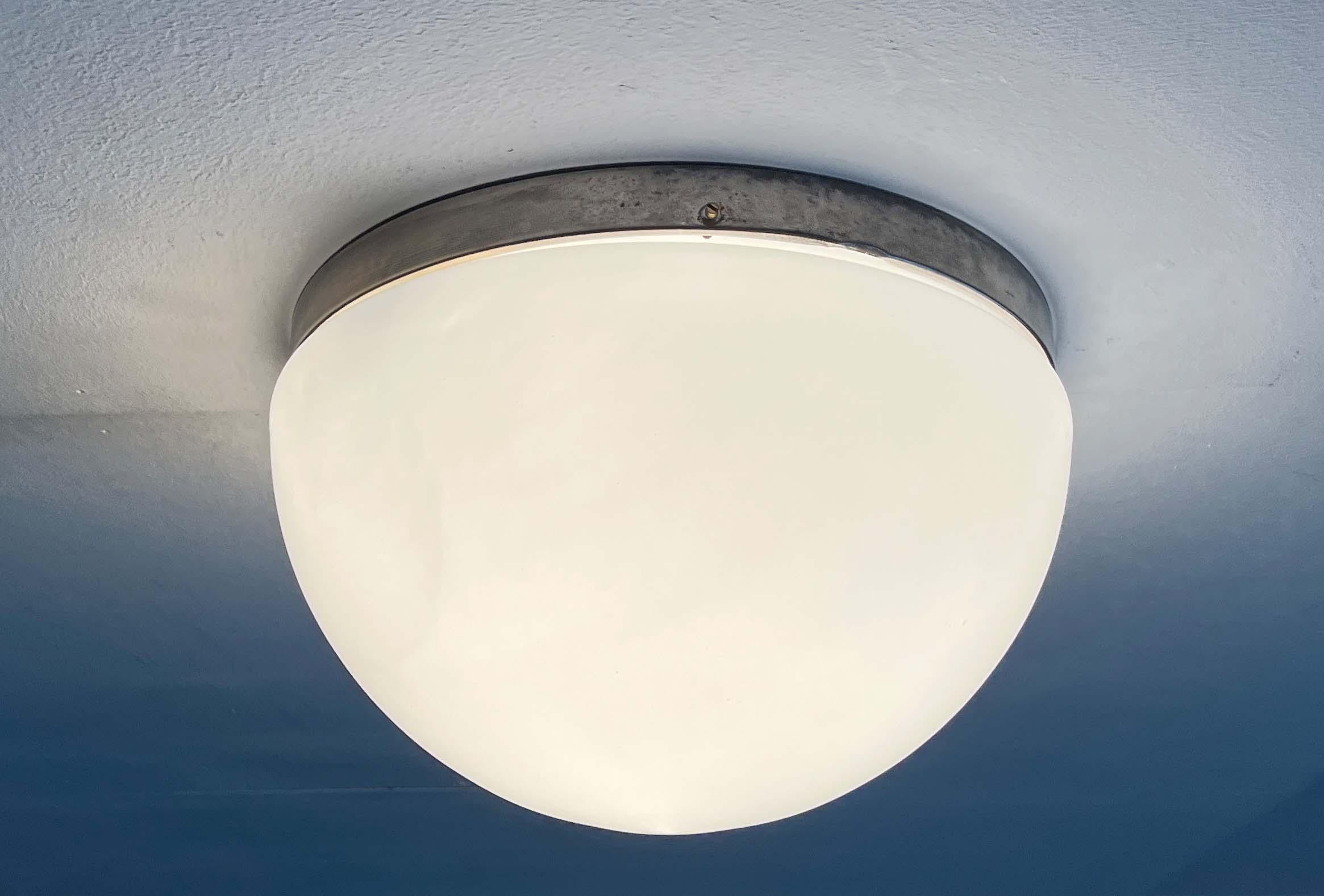 Mid-Century flush mount from Finland. Unfortunately, the manufacturer is unknown. However, it is reminiscent of Paavo Tynell's functional designs for Taito and Idman.  

A minimalist design. The lamp body consists of two elements, the base and the