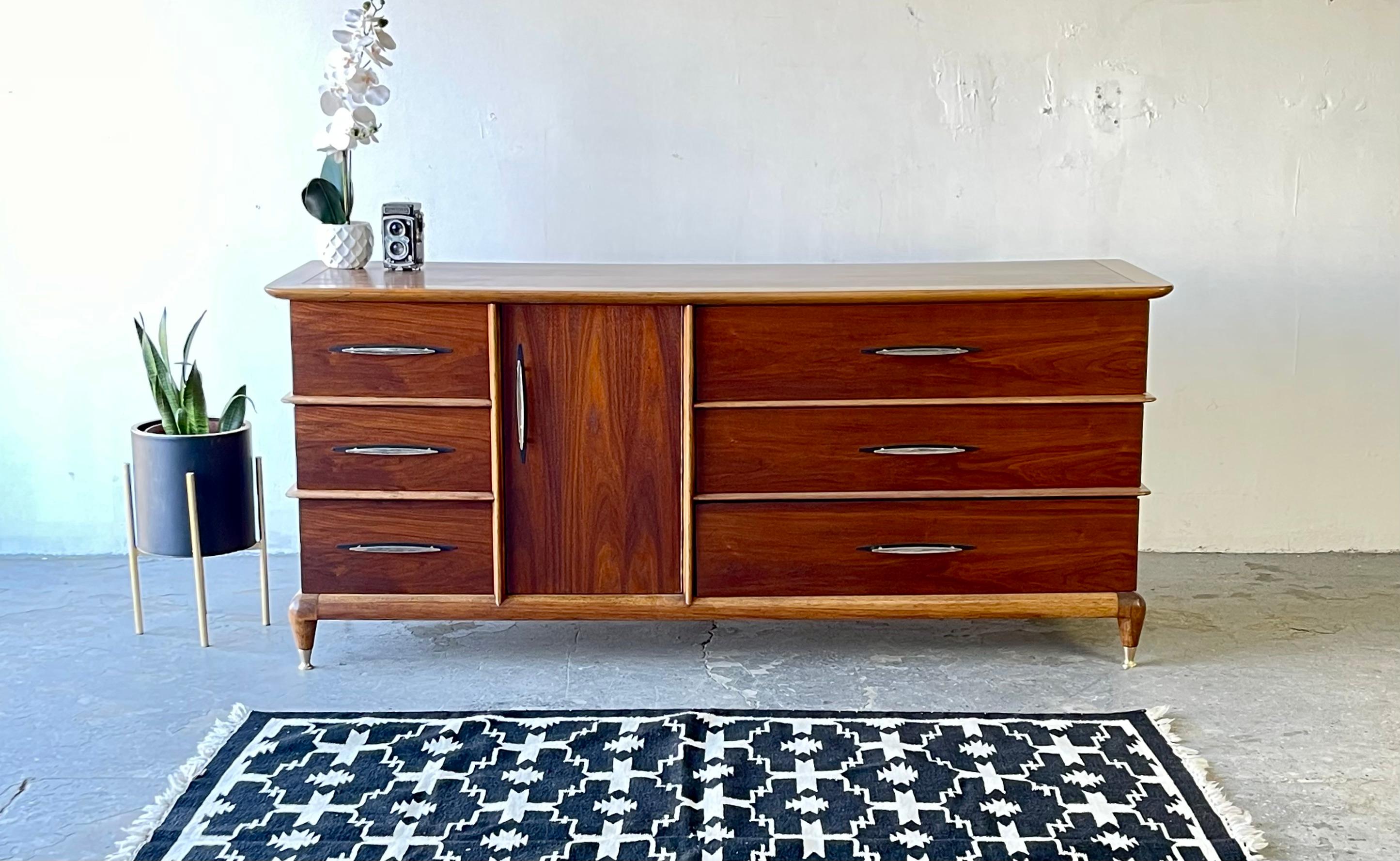 This unique vintage walnut dresser by Kent Coffey is from his 