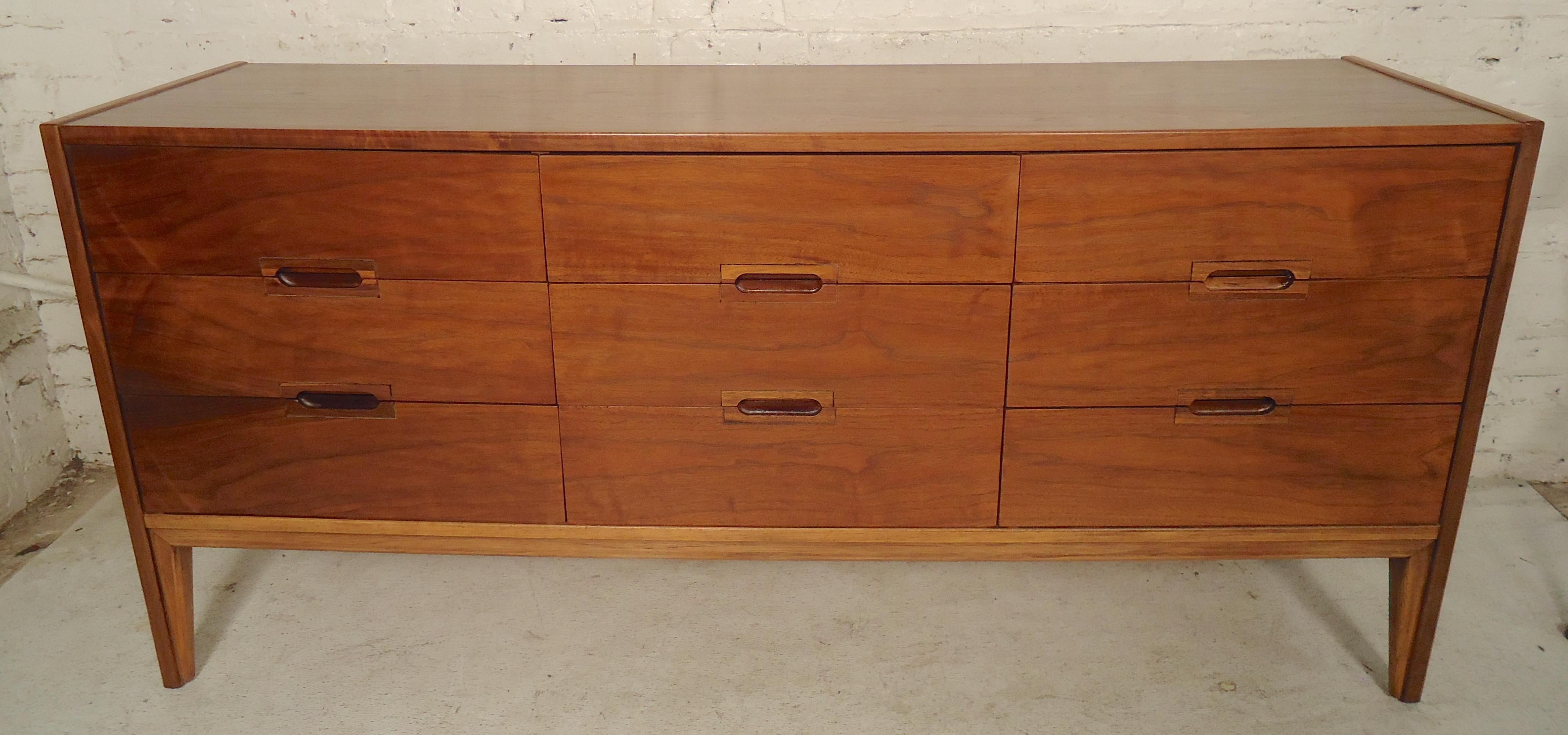 Long dresser with nine drawers. Walnut grain, tapered legs, inset handles.
(Please confirm item location - NY or NJ - with dealer).
  