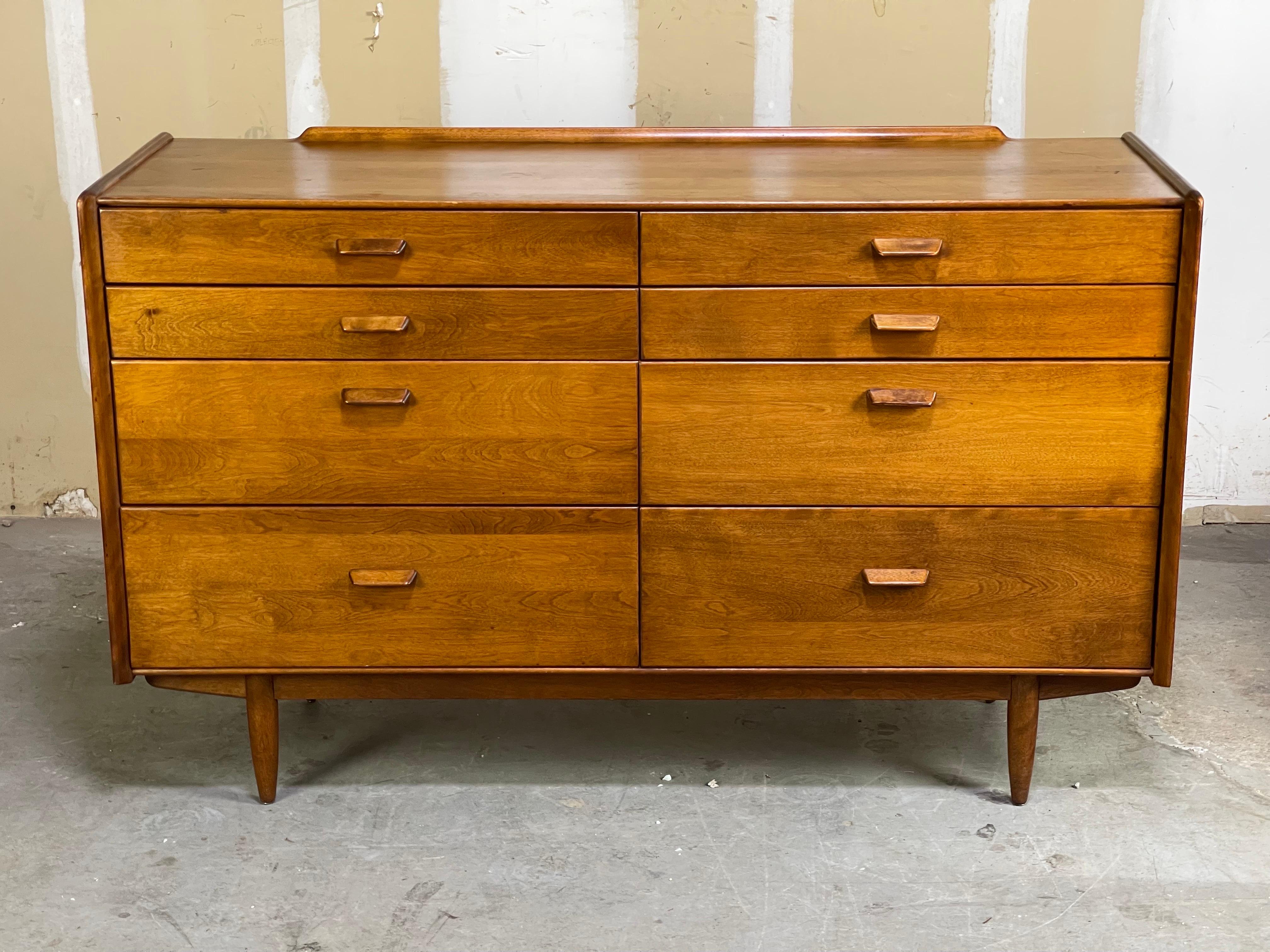 Lovely patina covered Mid-Century Modern dresser in solid staved Maple by Leslie Diamond for Conant Ball. Small cigarette burn and some hard to see scathes on the top for personality. Patina all over the front and pulls. Looks very close to Finn