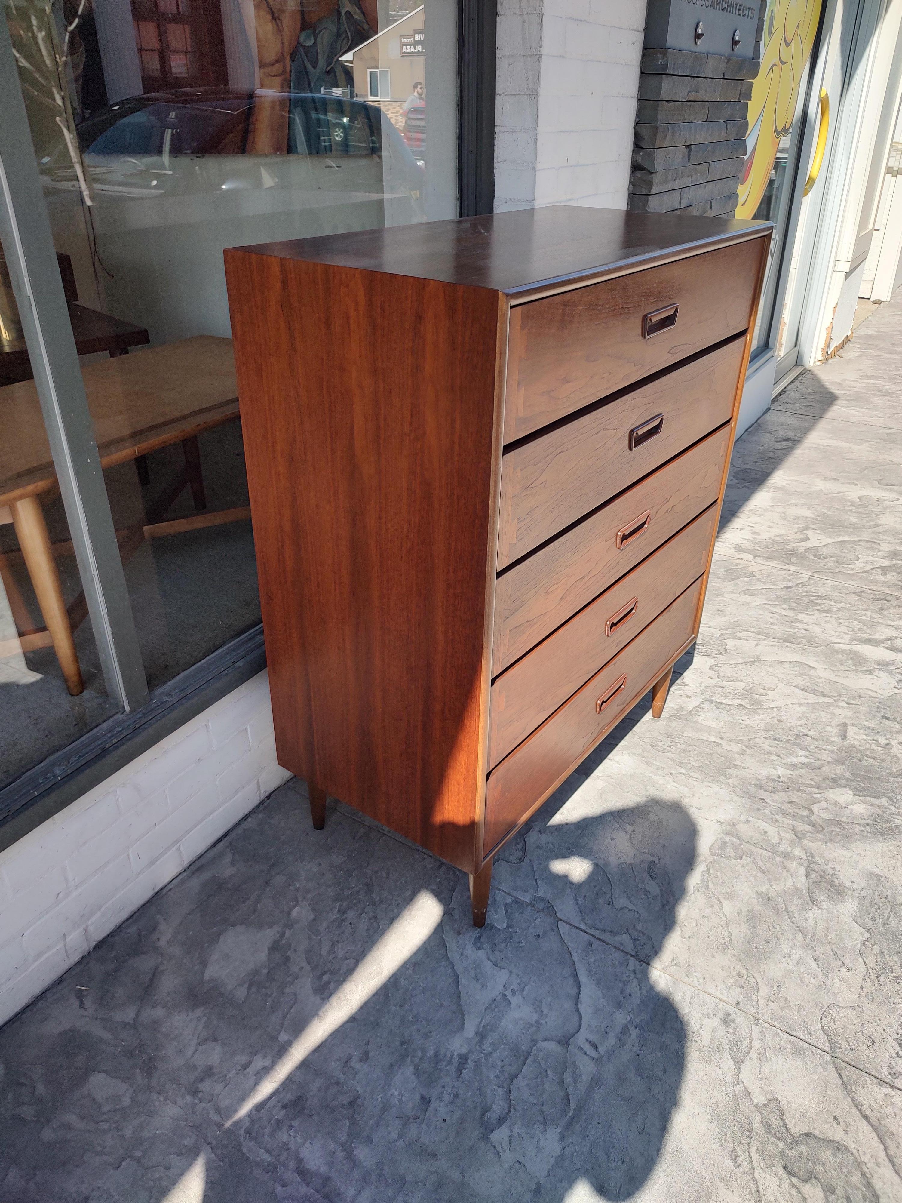 Fabulous and all original, even has the original tag brochure stapled to the inside of the top drawer. In excellent vintage condition with minimal wear. 5 drawer dresser designed by Andre Bus is a rare find and even rarer in original finish. The