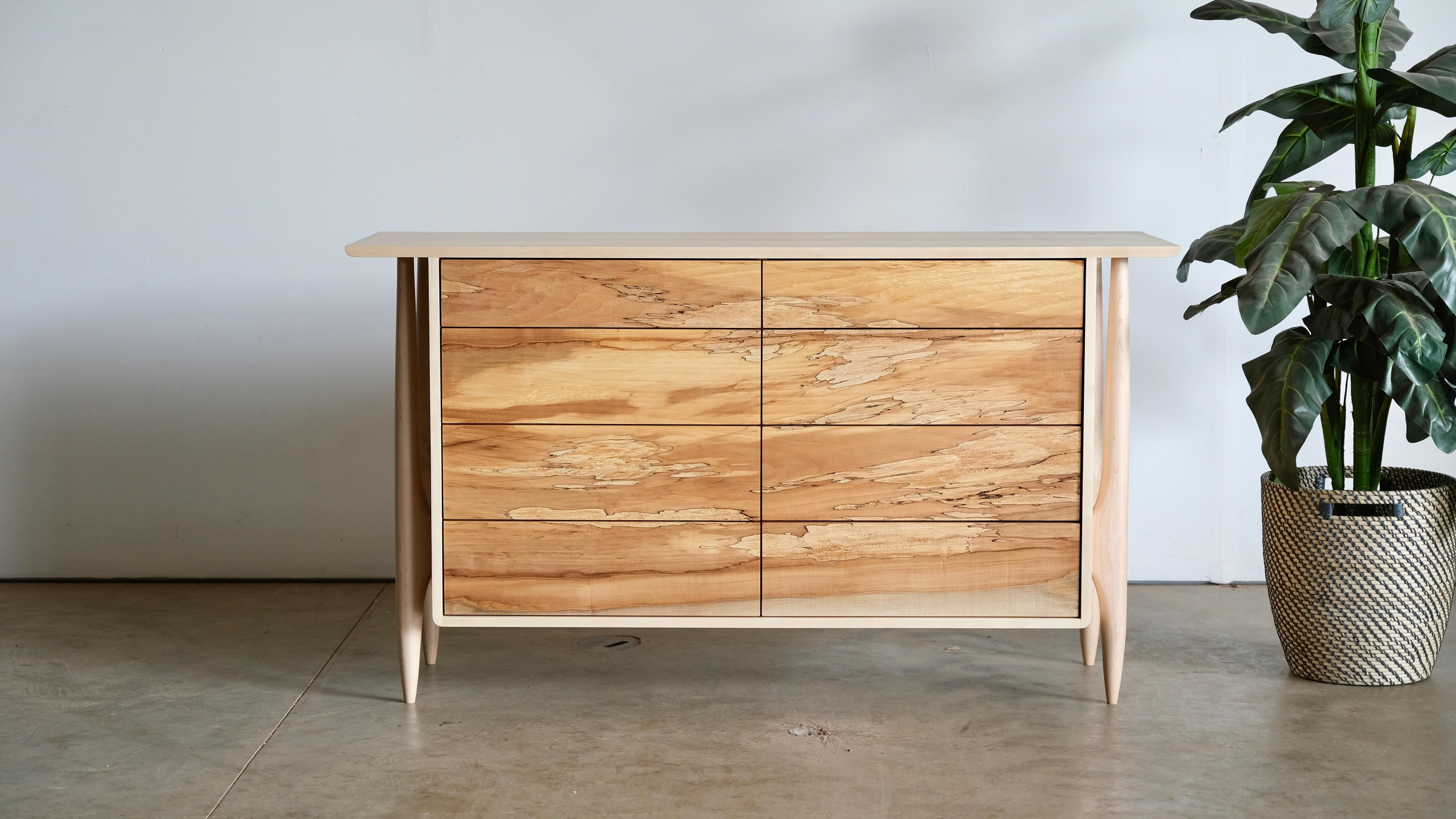 This dresser is made from all solid wood, including the drawers and built using several forms of exposed joinery and hand shaping. I would put this piece closer to a form of art than pure function. The exposed dovetail case, exposed through tenons
