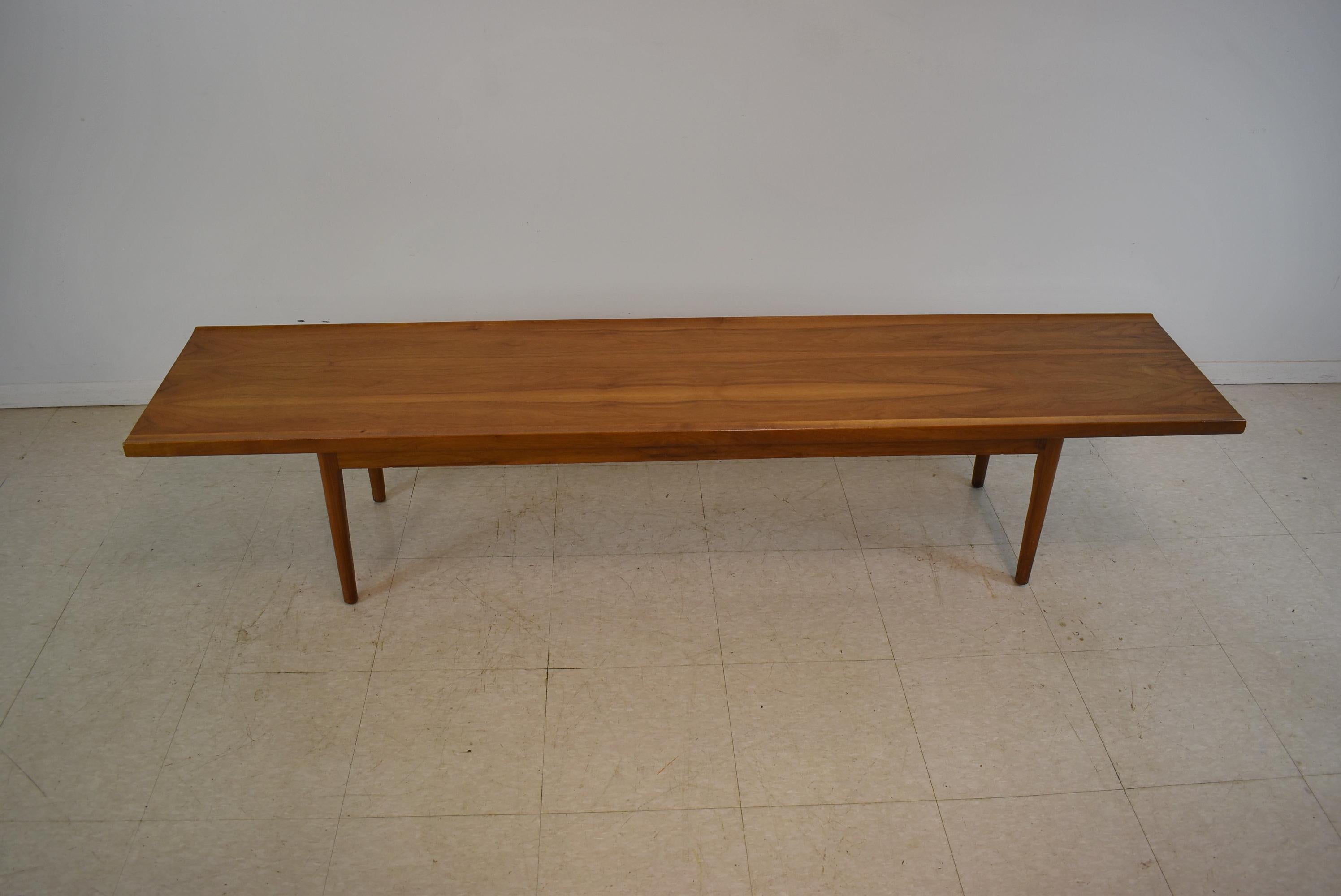 Mid-Century Modern walnut coffee table by Kipp Stewart for Drexel. Surfboard style 
with original finish. Stamped on the bottom. Very nice original finish with light wear. Dimensions: 16
