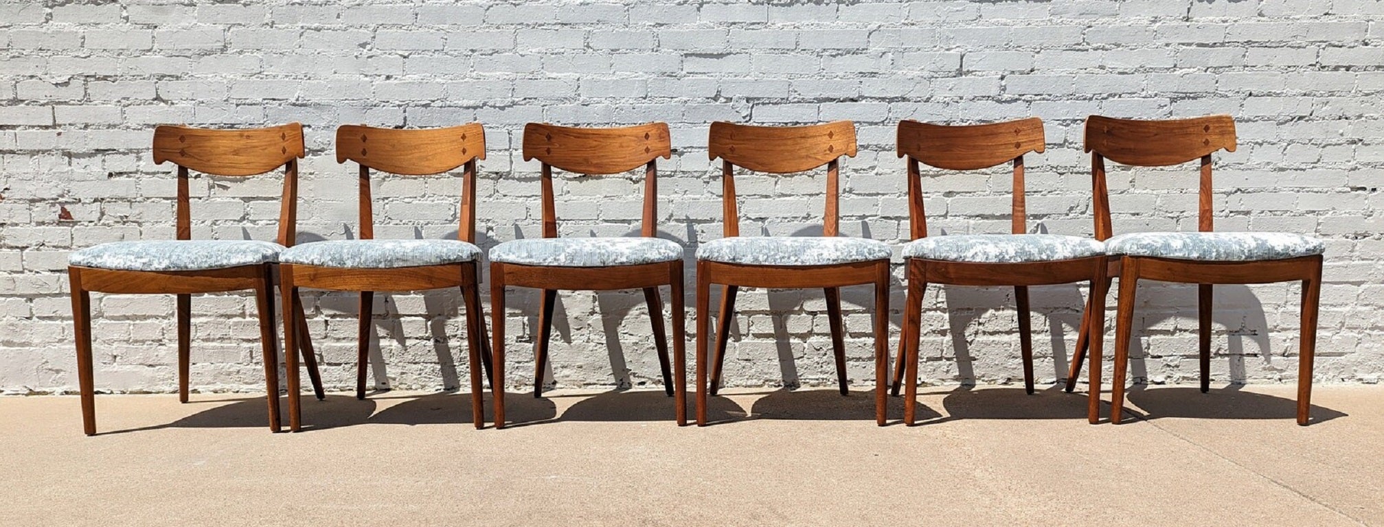 Mid Century Modern Drexel Declaration Dining Chairs
 
Above average vintage condition and structurally sound. Have some expected slight finish wear and scratching. Upholstery is new. Outdoor listing pictures might appear slightly darker or more red