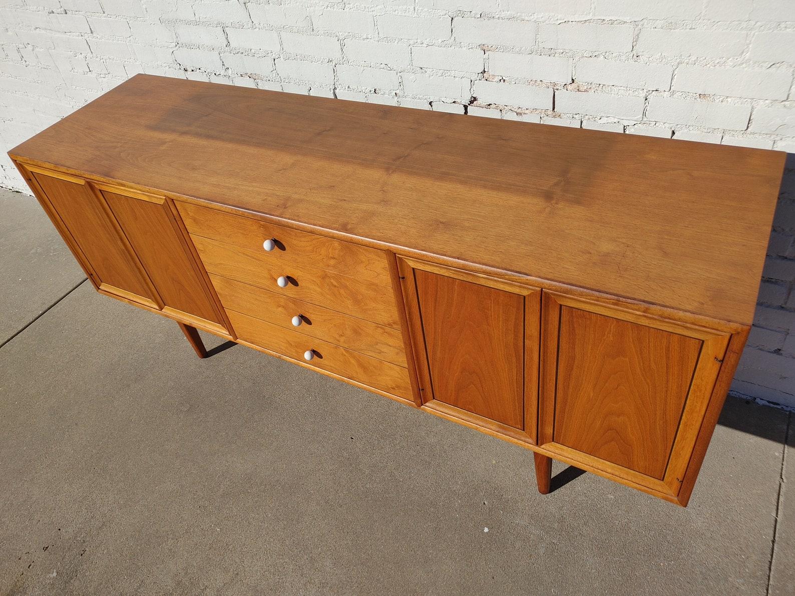 Mid Century Modern Drexel Declaration Sideboard/Hutch

Above average vintage condition and structurally sound. Has some expected slight finish wear and scratching. Please message with any questions.  
Scott

Additional information:
Materials: