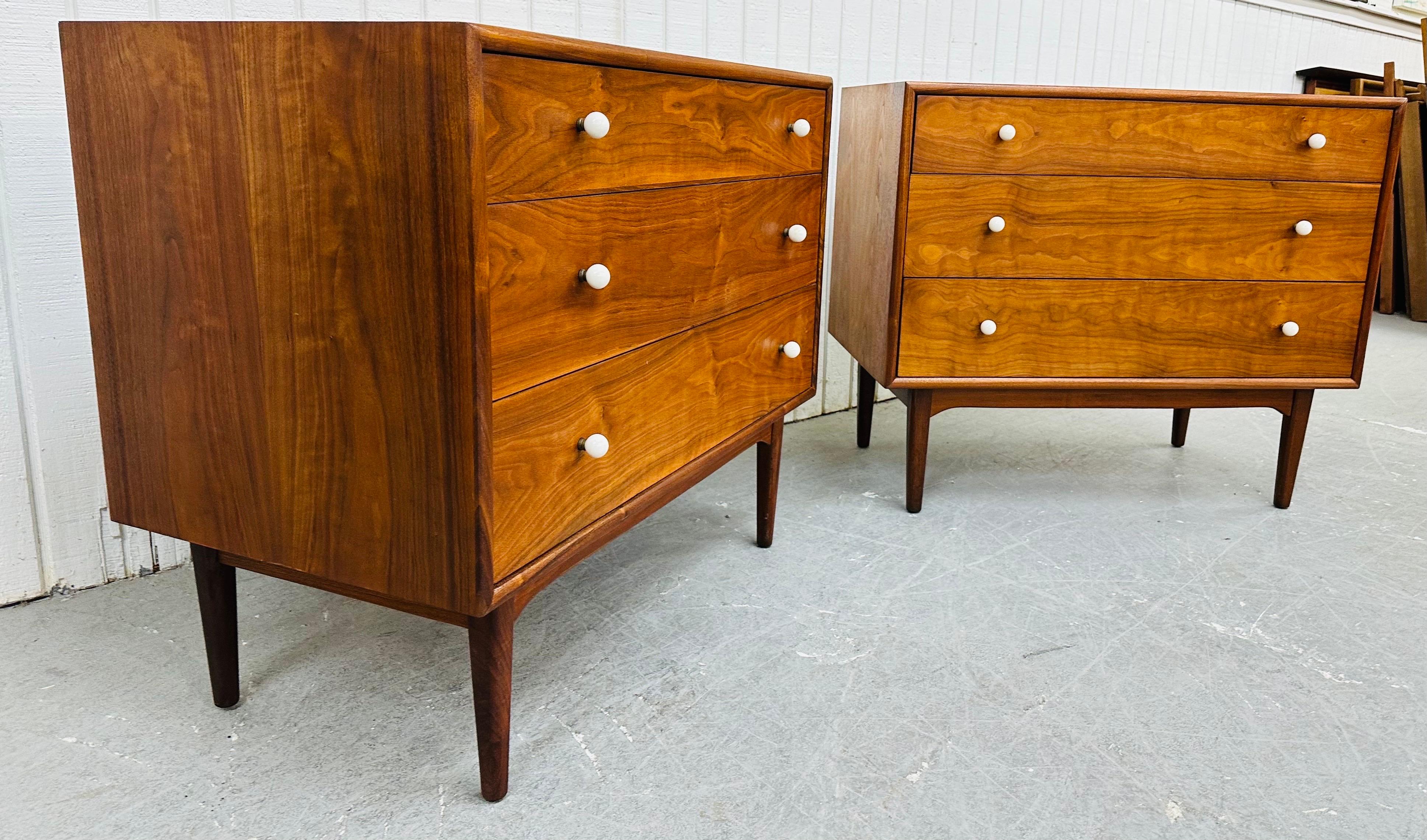 This listing is for a pair of Mid-Century Modern Drexel Declaration Walnut Bachelor Chests. Featuring a straight line design, three drawers for storage, original white milk glass hardware, modern legs, and a beautiful walnut finish. This is an