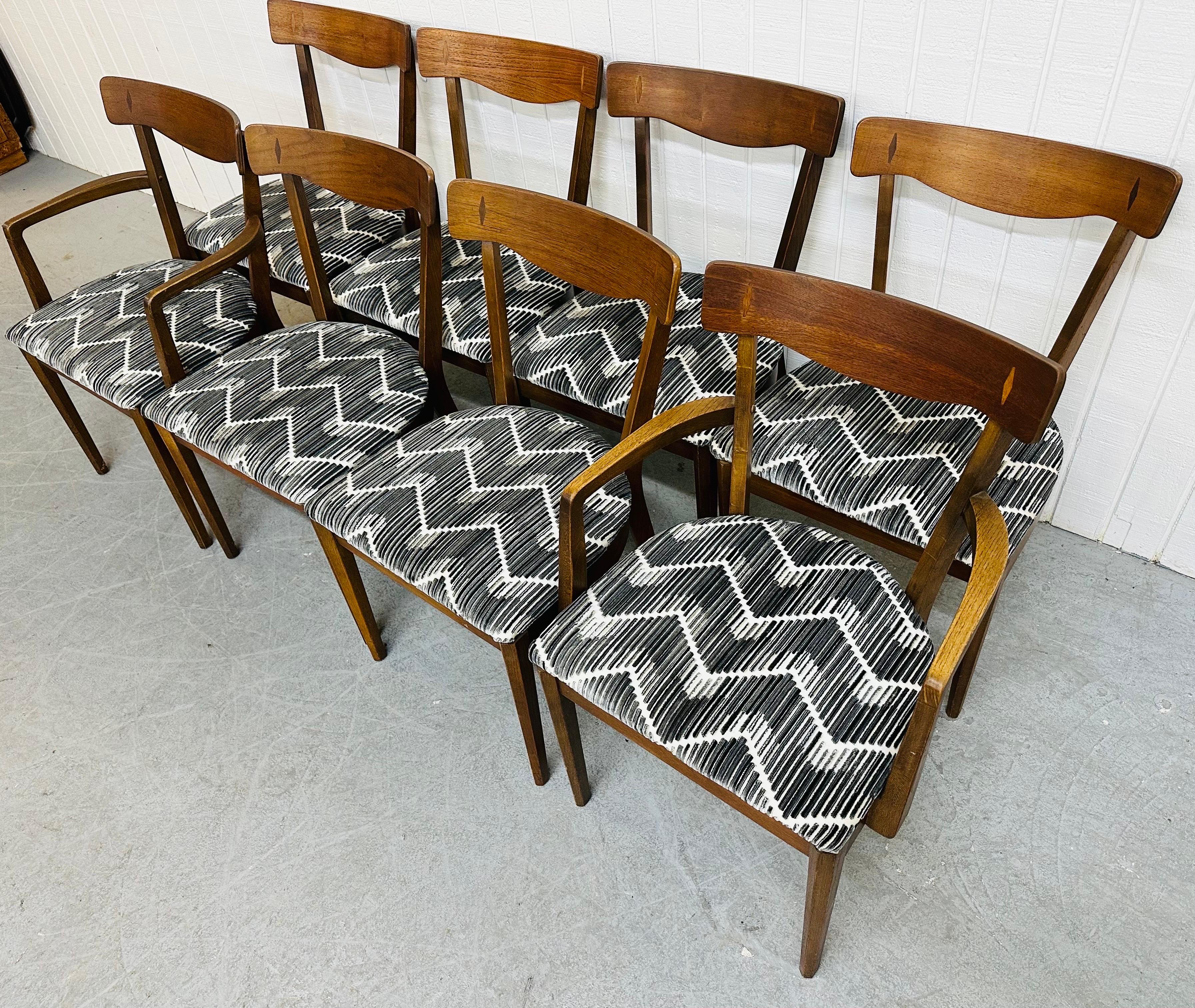This listing is for a set of eight Mid-Century Modern Drexel Declaration Walnut Dining Chairs. Featuring two arm chairs, six straight chairs, newly upholstered seats, and a beautiful walnut finish. This is an exceptional combination of quality and