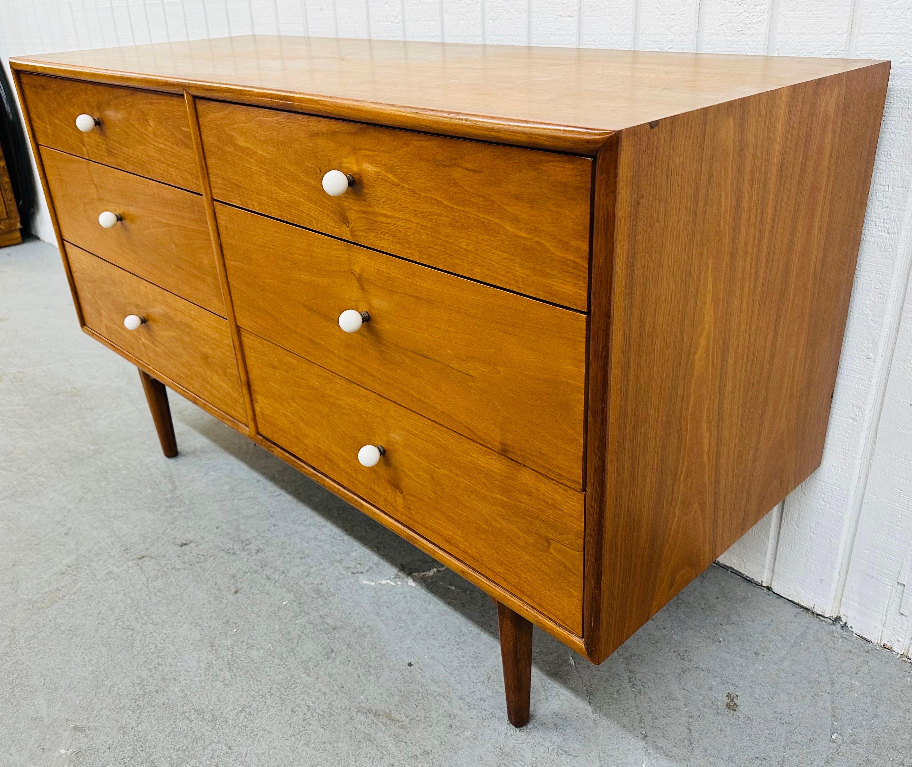 This listing is for a Mid-Century Modern Drexel Declaration Walnut Dresser. Featuring a straight line design, six drawers for storage, original milk glass white knobs, and a beautiful walnut finish. This is an exceptional combination of quality and