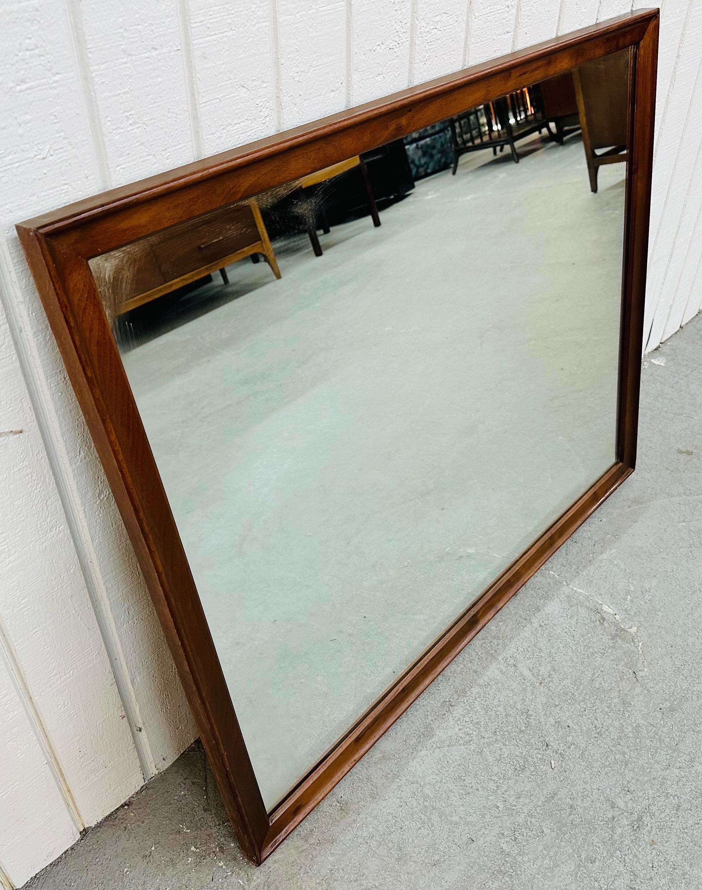 This listing is for a Mid-Century Modern Drexel Declaration Walnut Wall Mirror. Featuring a straight line rectangular design, solid wood frame, and a beautiful walnut finish. This is an exceptional combination of quality and design by Drexel!