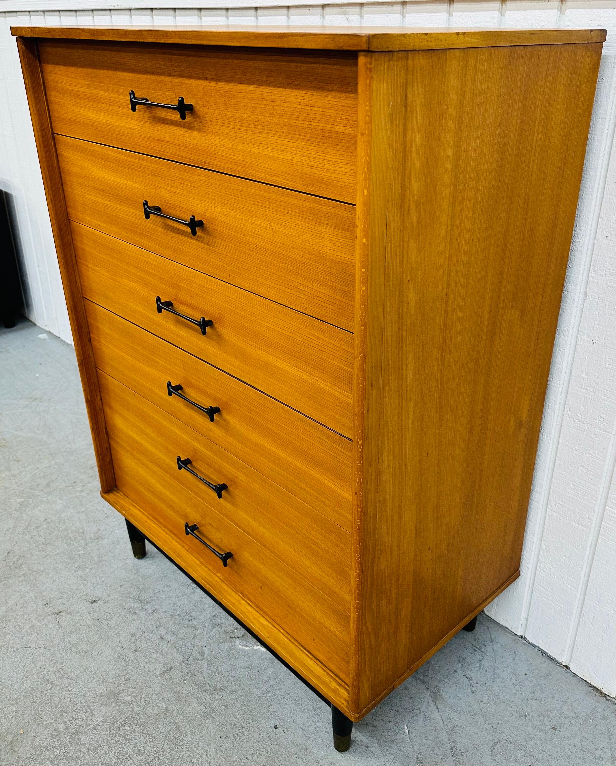 This listing is for a Mid-Century Modern Drexel Blonde High Chest. Featuring a straight line design attributed to designer Milo Baughman, six drawers for storage, sculpted black pulls, black legs with brass caps, and a beautiful blonde finish. This