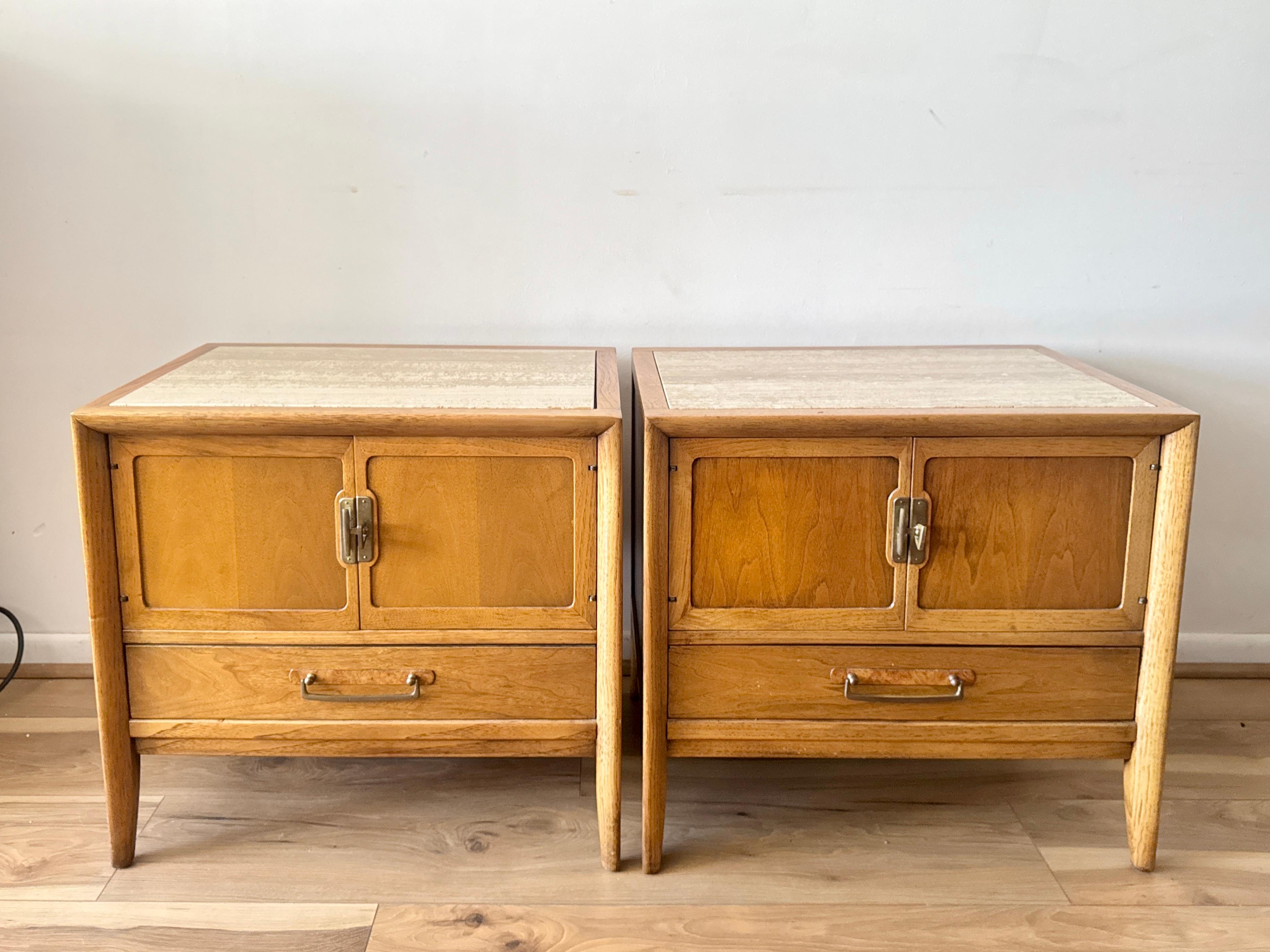 Vintage Drexel nightstands, a true mid-century modern masterpiece. Crafted from high-quality walnut wood with a warm, rich finish, this 1960s piece features sleek lines, elegant recessed pulls, and Italian travertine stone inserts on the top surface