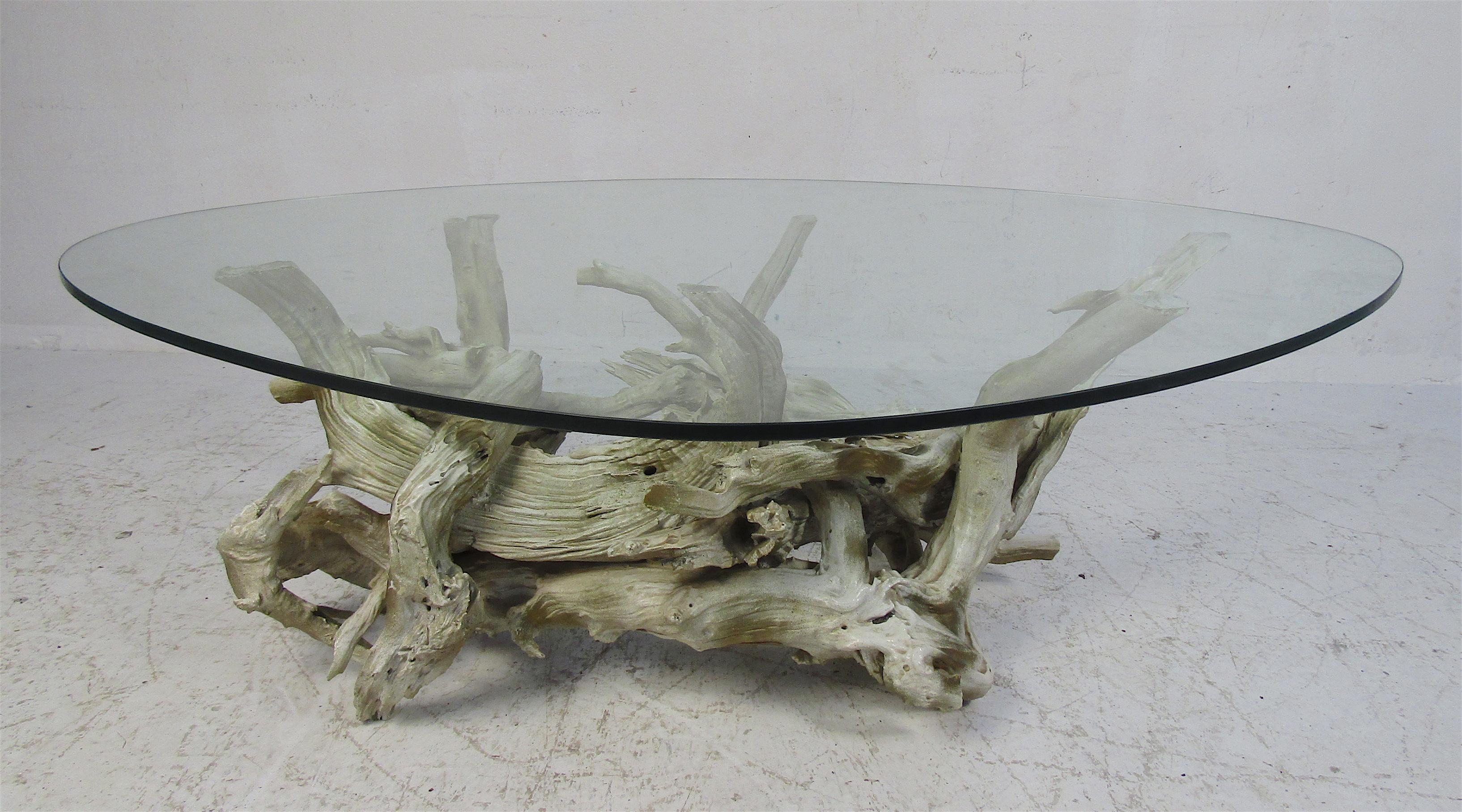 This stunning vintage modern coffee table boasts an unusual driftwood base and a thick glass top. The perfect addition to any home, business, or office. Please confirm item location (NY or NJ).