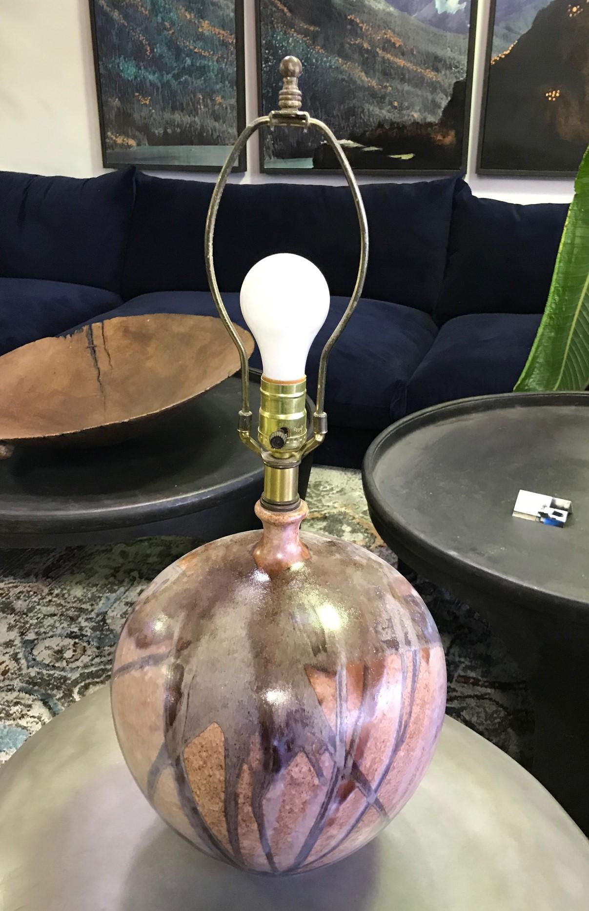 A fantastic piece, beautifully colored and designed. Caught our eye right away.

Would stand out in about any setting, modern or otherwise.

Comes as shown. Needs lamp shade.

Dimensions: 25