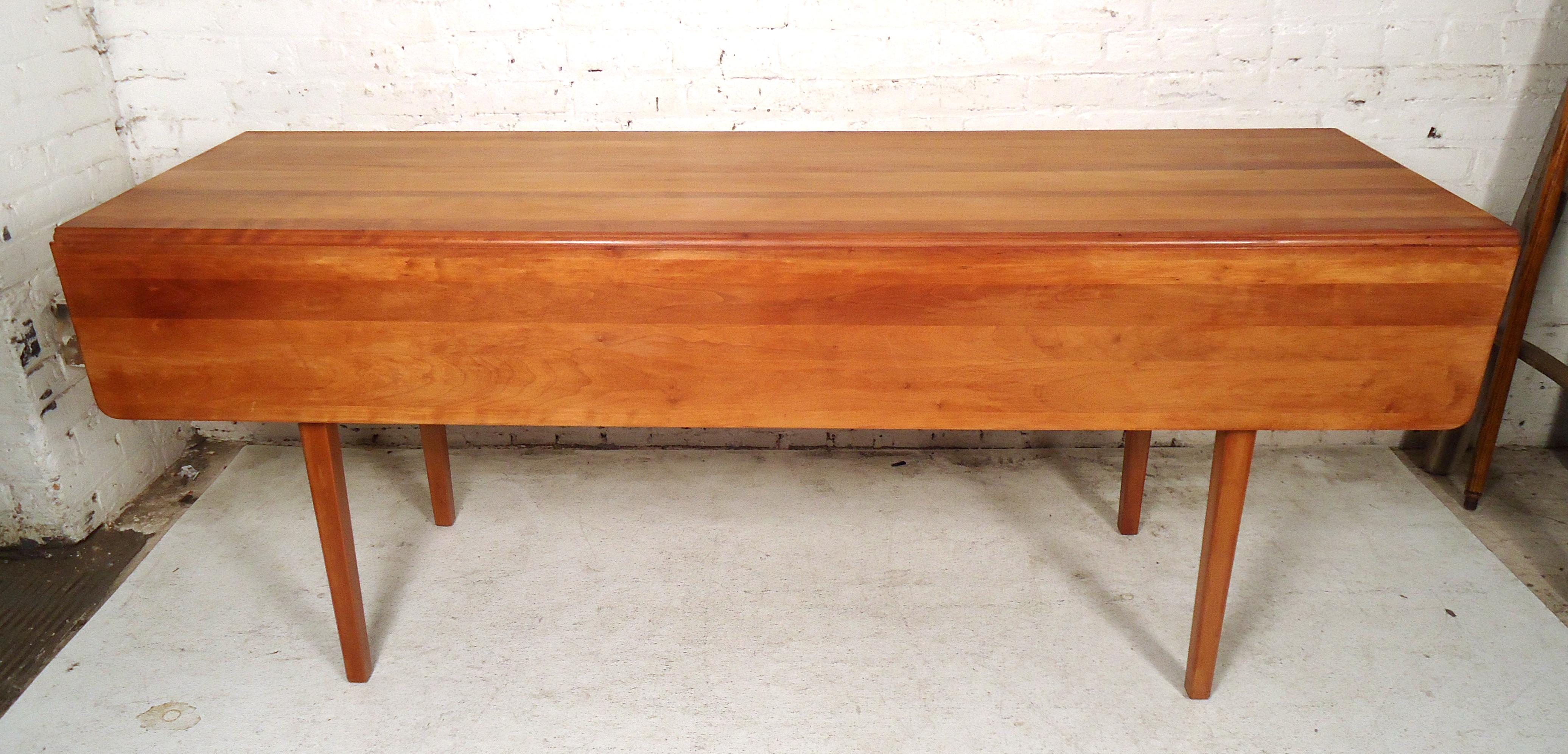 Vintage modern wood veneer drop leaf, can be used as dining or console table features sturdy legs and easy to maneuver. 

(Please confirm item location - NY or NJ with dealer).